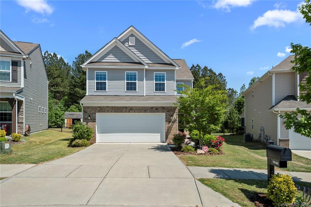 Welcome to this adorable home in the Walnut Creek neighborhood in Lancaster, SC; just a short drive from the new shopping center and growing Indian Land, SC! This home has many notable features, some of which include: two story foyer; hardwood floors; open floor plan between the living room, kitchen, and dining area; gas log fireplace in the living room; and lots of natural light. The chef's kitchen has granite counter tops, a tile back splash, plenty of cabinets and storage options, and stainless steel appliances. Upstairs is the over-sized owner's suite which features an ensuite bathroom with garden tub, tiled shower, dual sinks; and a large walk in closet! Two large bedrooms share a full bath, and another bedroom has a private full bath attached. Enjoy time on the back patio which overlooks a private and fully fenced flat backyard! We love the resort style amenities in Walnut Creek! Make this house your home today! Ask us about our Zero+ Mortgage plan.