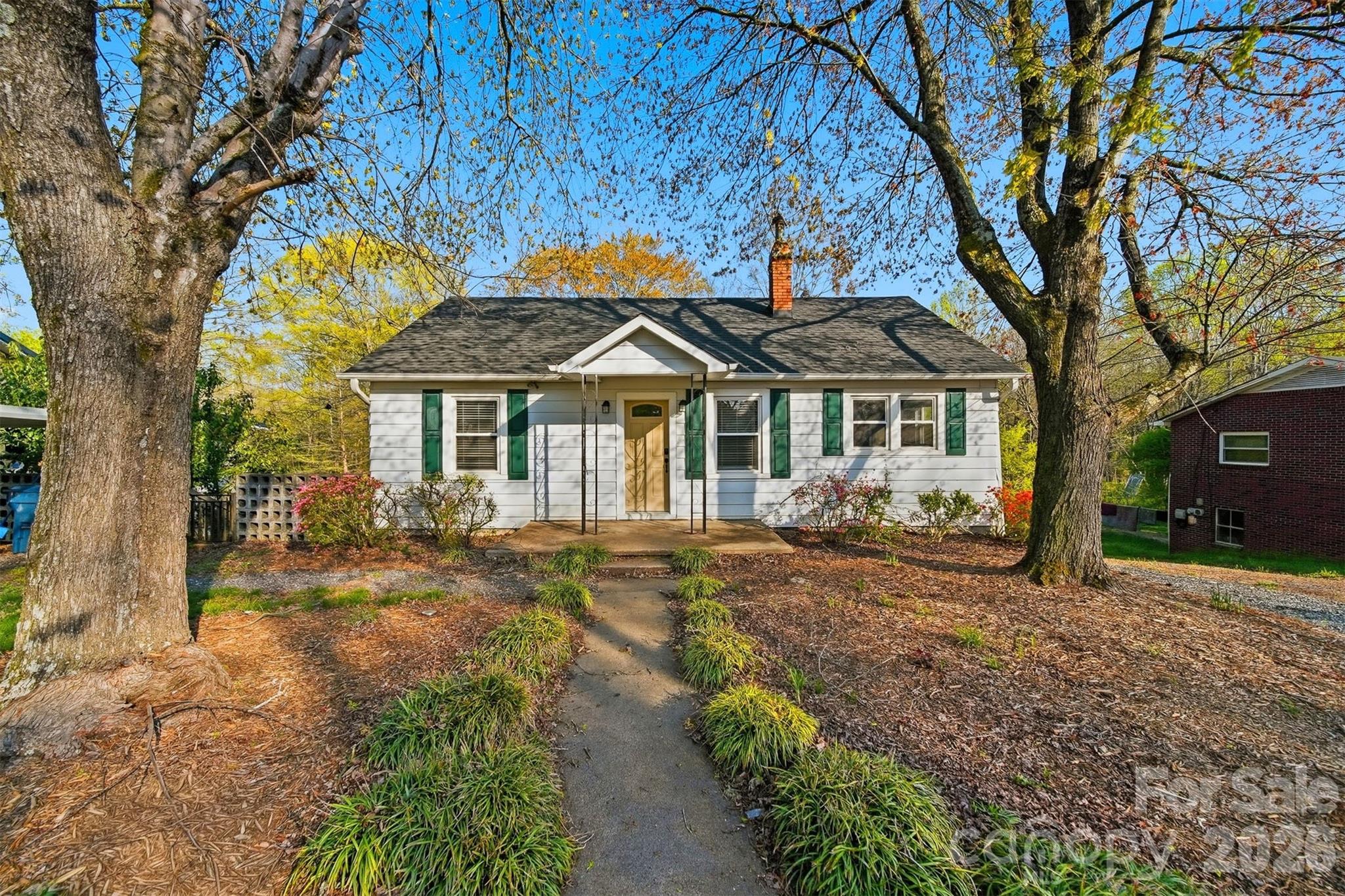 Located at 2036 4th Street NE in Hickory, NC, this thoughtfully updated home offers a rare combination of modern improvements, generous outdoor space, and functional versatility. Situated on approximately 0.56 acres, the property provides room to enjoy outdoor living while remaining conveniently positioned near everyday amenities, employment centers, and major roadways.

Inside, the home features approximately 900 square feet of well-designed living space with two bedrooms and one full bathroom. Over the past few years, numerous updates have been completed, creating a move-in-ready environment while preserving flexibility for future customization. Durable luxury vinyl plank flooring runs throughout the home, complemented by fresh interior paint that creates a clean and welcoming atmosphere.

The living room offers a comfortable gathering space enhanced by a ceiling fan for added comfort. The kitchen has been updated with an electric range and stainless steel refrigerator, providing both function and modern appeal. A dedicated dining area opens directly to the rear deck, creating a natural flow for everyday living and easy access to outdoor space.

Both bedrooms are well-proportioned and filled with natural light, while the full bathroom is centrally located for convenience. The home also includes a full unfinished basement, offering abundant storage and future potential. The basement includes laundry hookups and can easily accommodate hobby space, storage needs, or long-term planning for additional finished areas.

A new front door enhances curb appeal, while French doors connect the interior living space to the backyard, bringing in natural light and expanding the usable footprint of the home. A carport provides covered parking, and a separate workshop adds valuable utility for tools, projects, or additional storage.

One of the most significant updates includes new plumbing from the road to the home, delivering long-term peace of mind and reducing future maintenance concerns. Combined with newer flooring, appliances, and finishes, these improvements create an attractive option for buyers seeking reliability and efficiency.

With its sizable lot, recent upgrades, and adaptable spaces, this property presents strong appeal for a variety of ownership goals — whether as a primary residence, a simplified living option, or an investment opportunity. The combination of indoor updates, outdoor amenities, and location within Hickory makes 2036 4th Street NE a compelling choice for buyers seeking value, functionality, and future potential.