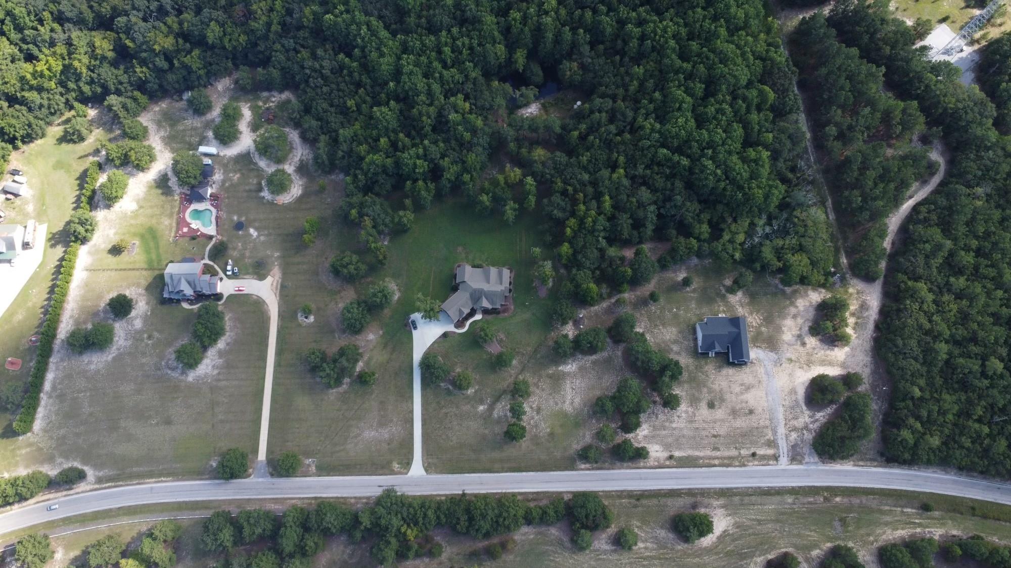 A beautiful location to build your dream home. Several prestigious custom homes have been built in this community. Minimum of 2000 ft. of heated living area. Seller has septic permit. Property can NOT be subdivided.