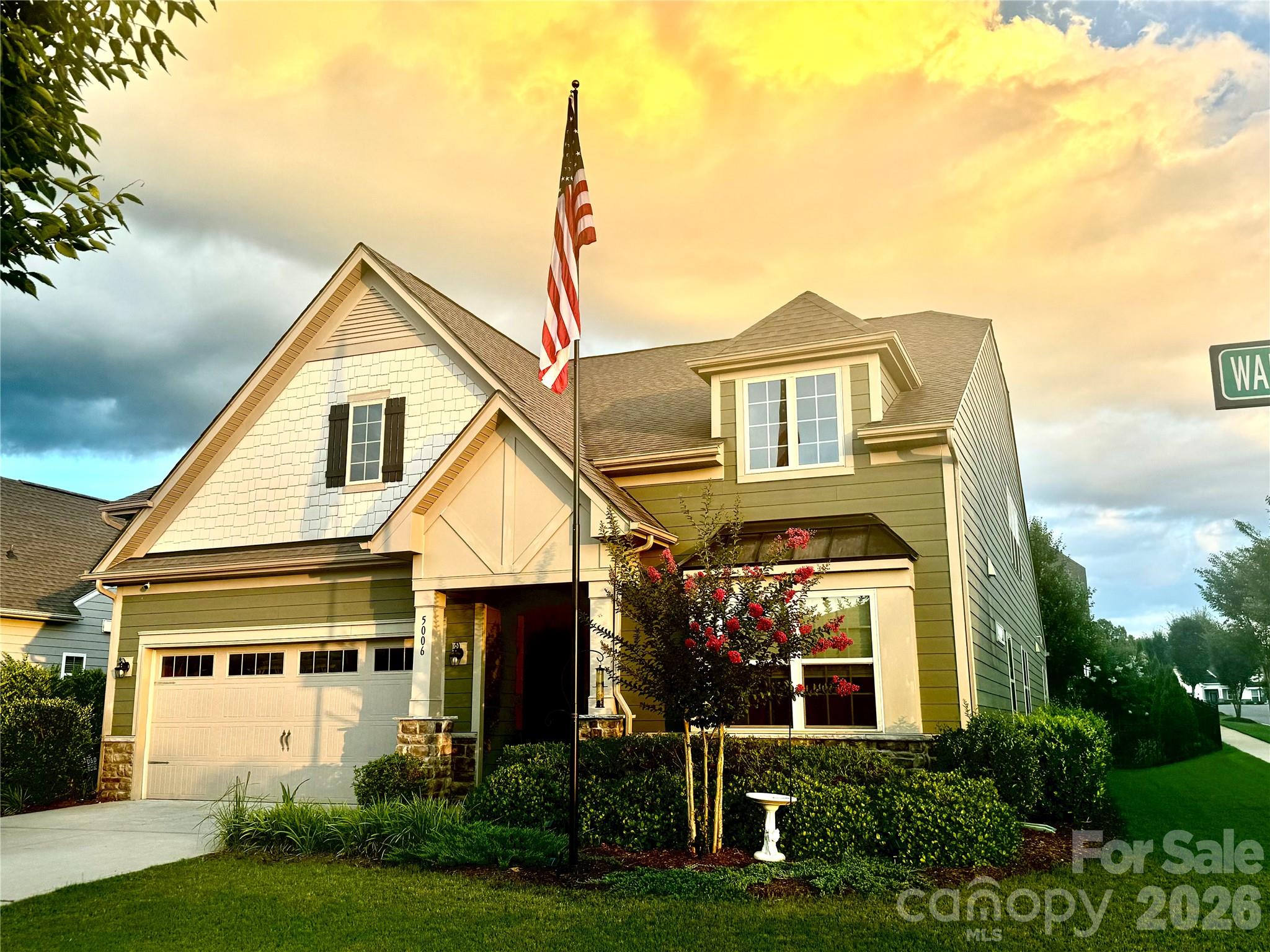 Welcome to this beautifully appointed 1.5-story home in the highly sought-after Summerhouse at Paddlers Cove in Lake Wylie. Built in 2018 and meticulously maintained, this 4-bedroom, 3-bath residence offers nearly 2,900 square feet of thoughtfully designed living space on a desirable corner lot.
The open-concept floor plan is ideal for both everyday living and entertaining, featuring a spacious family room with a cozy gas fireplace and striking stacked stone accent wall. The gourmet kitchen seamlessly connects to the living area and includes a large island, gas range, double ovens, walk-in pantry, and abundant cabinetry.
The main level offers a generous primary suite with a walk-in closet and well-appointed bath, along with two additional bedrooms, a full bath, and convenient main-level laundry. Upstairs, you’ll find a private guest suite with a full bath and versatile flex space—perfect for visitors, a home office, or bonus room—plus two walk-in attic storage areas and an additional double closet for exceptional storage.
Step outside to enjoy year-round living on the covered and screened L-shaped rear porch overlooking a fenced backyard with an expansive stone patio—ideal for relaxing or entertaining. The landscaped grounds feature a variety of flowering bulbs, including heirloom varieties dating back to the 1850s, lovingly passed down through the owner’s family. Additional highlights include a 2-car garage with electric vehicle charging capability and mobility-friendly features.
Residents of Summerhouse at Paddlers Cove enjoy exceptional community amenities, including two clubhouses, two pools, a playground, walking trails, and sidewalks—all just minutes from Lake Wylie, shopping, dining, and top-rated Clover schools.
This move-in ready home perfectly blends comfort, style, and community living—don’t miss the opportunity to make it yours.