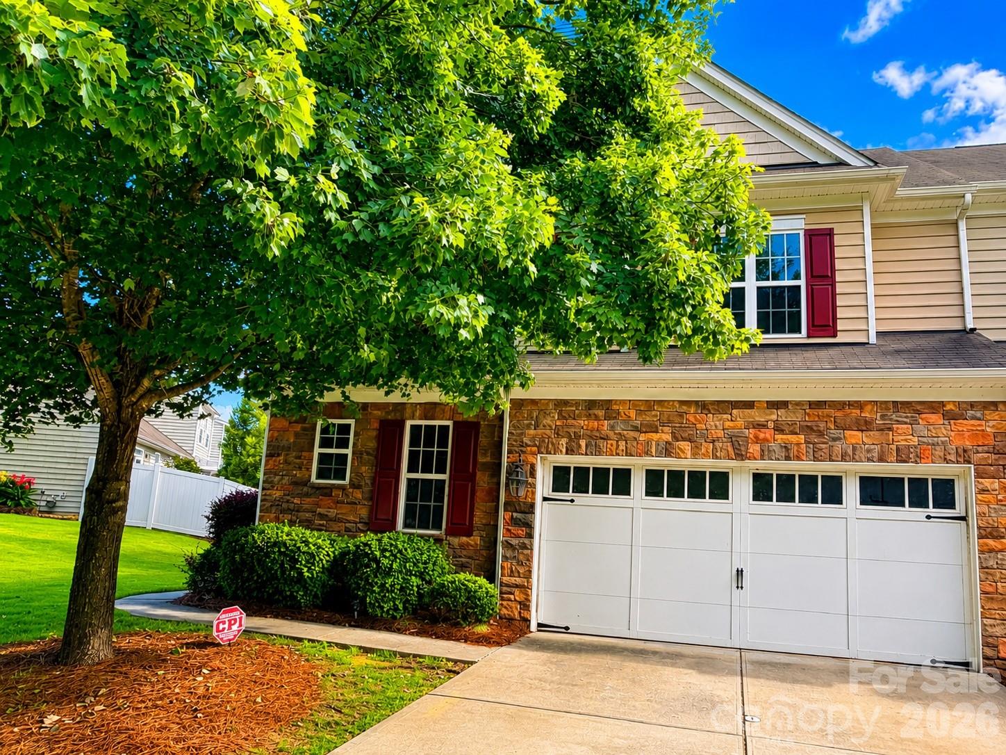 Beautifully updated End unit townhome in desirable Stone creek ranch community featuring fresh interior paint, brand-new carpet, and a professionally finished epoxy garage floor. The bright, open floor plan is highlighted by soaring ceilings, skylights that flood the family room with natural light, and a cozy fireplace. The upgraded kitchen offers granite countertops, stainless steel appliances, and ample cabinetry. The spacious primary suite features a vaulted ceiling, creating a relaxing retreat. Upstairs, you'll find a versatile loft, two additional bedrooms, and a bonus room—perfect for movie nights. Enjoy the flat backyard with just enough space for outdoor activities and entertaining. Ideally located just minutes from Rea Farms, Waverly, shopping, dining, I-485, and not to mention highly rated schools. This move-in-ready home offers the perfect blend of space, style, and convenience.