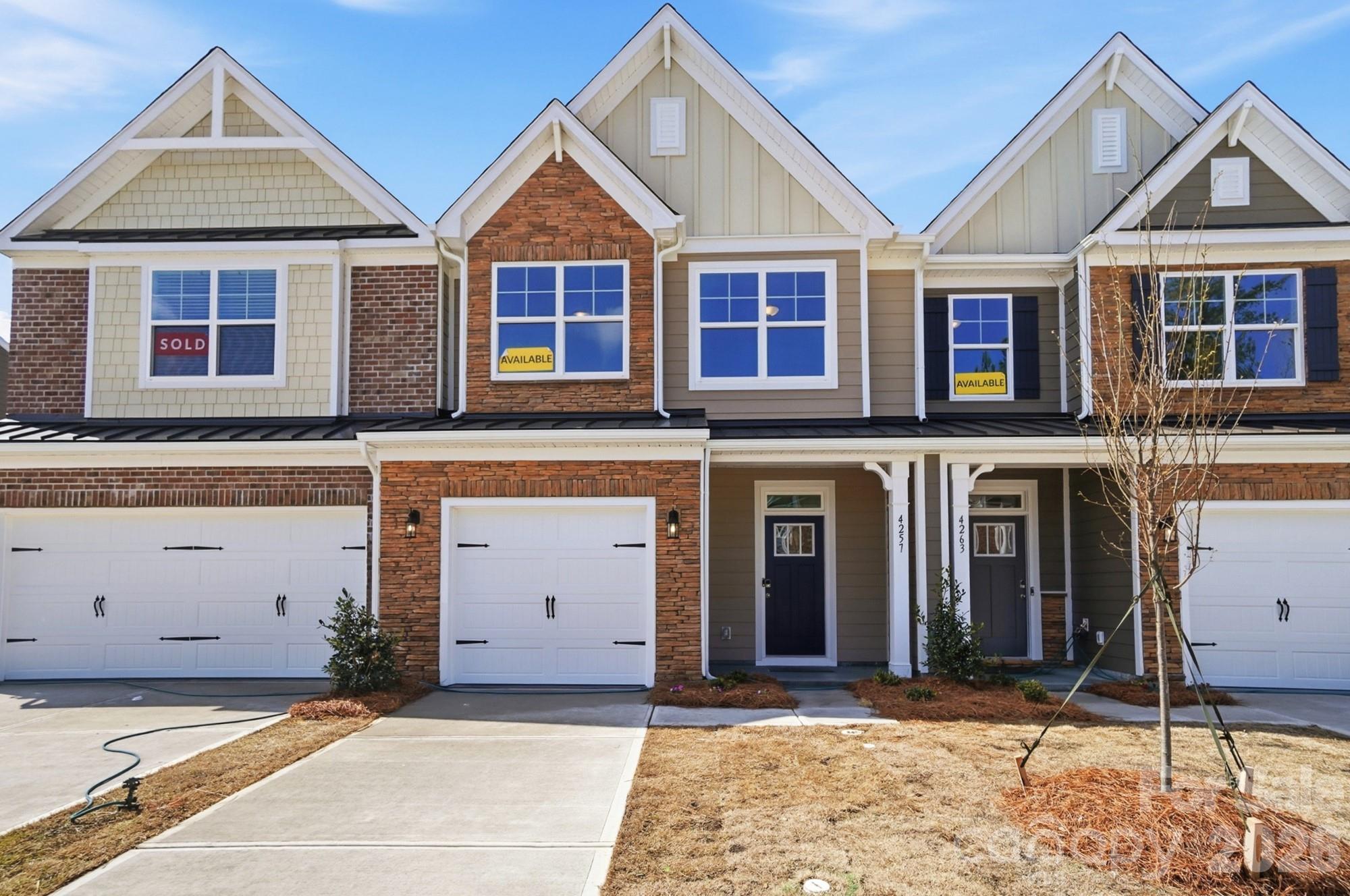 New townhomes in Harrisburg! This Ashland plan has 3 bedrooms, 2.5 baths, and more than 1,800 square feet of living space. The beautiful kitchen has Shaker-style, white cabinets, quartz counters, white tile backsplash, and stainless appliances, including a gas range. The kitchen opens into the dining area and family room. Stairs with metal balusters lead to the upper floor that has a loft, laundry room, two secondary bedrooms, a hall bath, and the spacious primary suite. The primary bath has a tiled shower with a bench seat, dual-sink vanity, and a linen closet. Additional extras include a foyer with tray ceiling and a built-in drop zone and quartz counters in all baths. This home has a rear covered porch and a privacy fence between rear yards. Community amenities feature a dog park, playground, paved walking trail, outdoor pool & cabana.