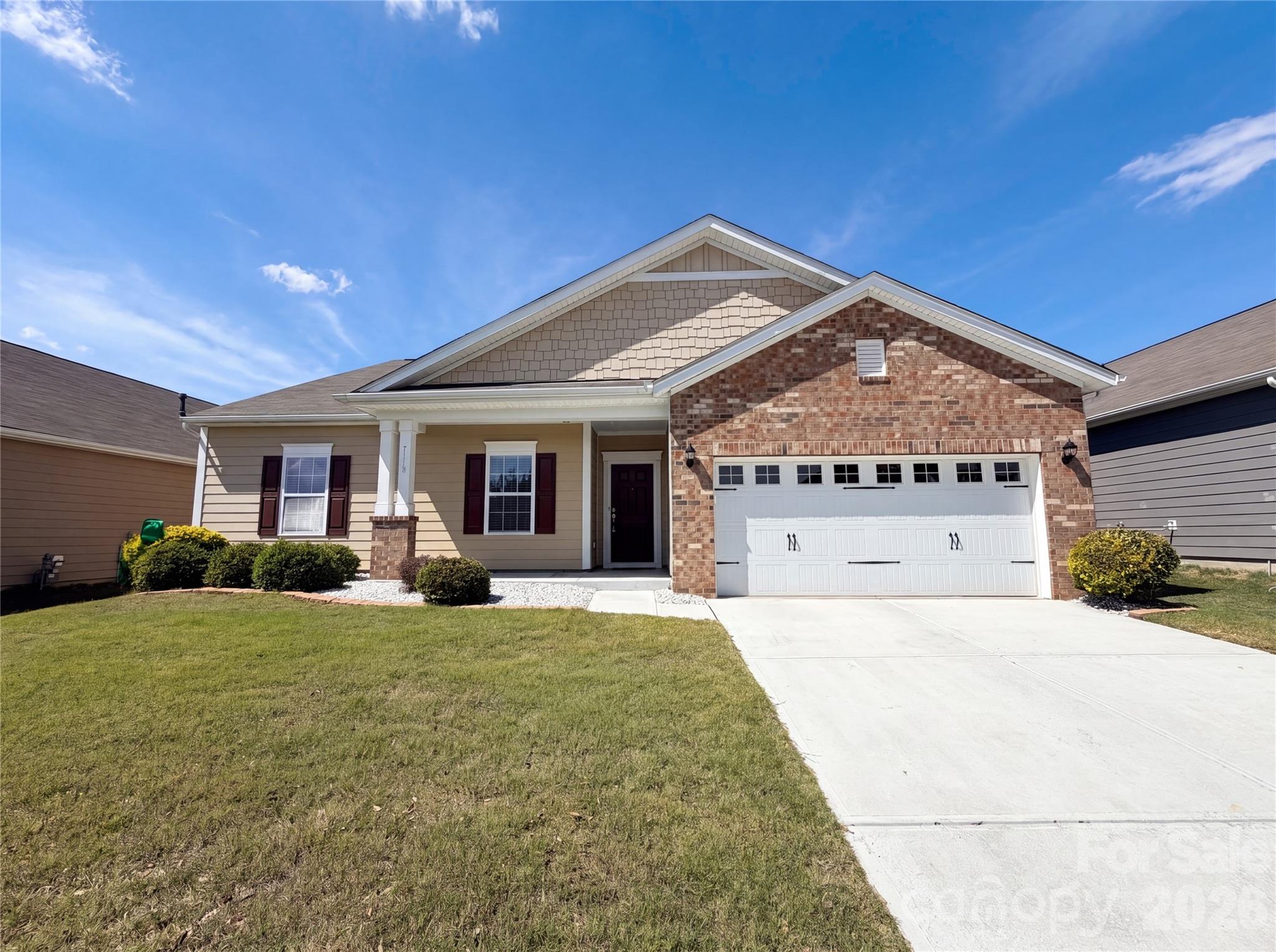 Imagine 7110 Strawberry Fields Ln, a residence designed for seamless daily living and practical comfort. The kitchen is equipped with all stainless steel appliances, a functional kitchen island, and an appealing accent backsplash. The primary bathroom with double sinks and a separate tub and shower. Outside, a comfortable patio extends to a fully fenced in backyard. Discover an exceptional combination of style and everyday convenience. Included 100-Day Home Warranty with buyer activation