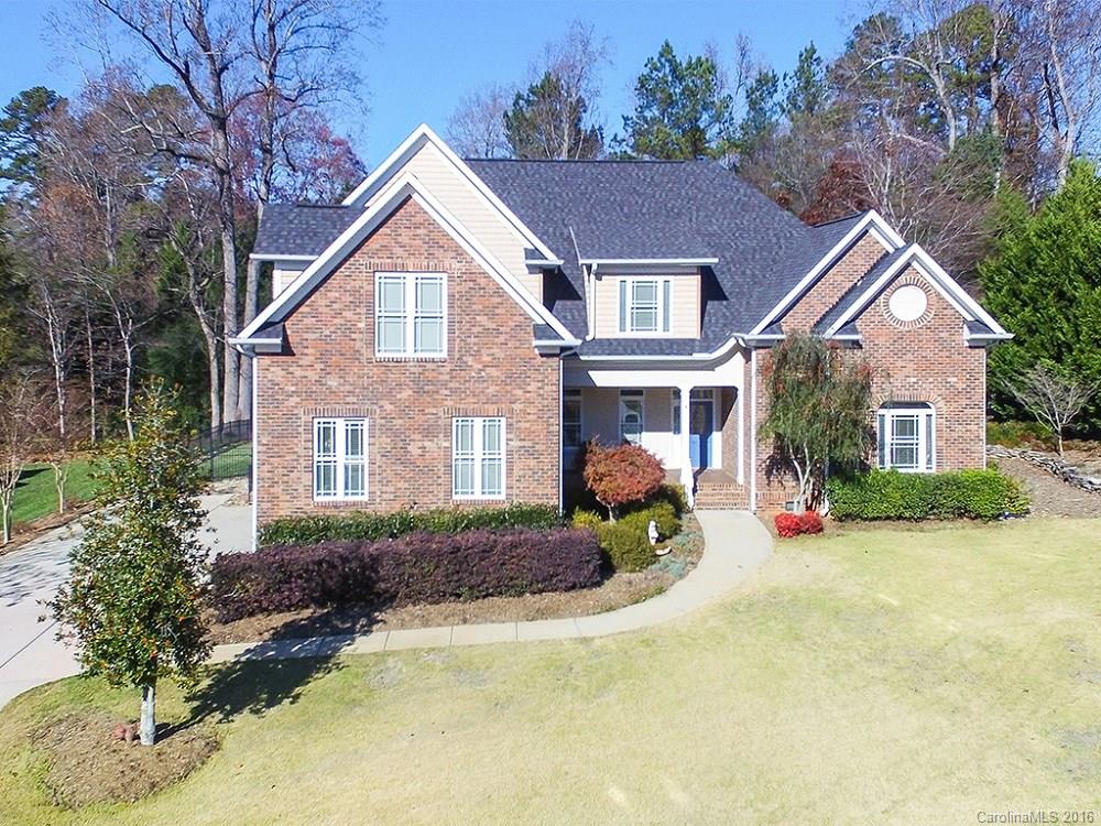 Gorgeous Fort Mill home in beautiful lake community.   Custom designed for flexible family needs, including potential for multi-generational living. Master suites with sitting rooms and garden Jacuzzi baths up and down.  Guest BR with bath downstairs. Separate living quarters/mother-in-law/nanny suite with its own kitchen and laundry upstairs. Huge, (700 ft.² ),walk-in attic. Screened porch and patio looking over beautifully landscaped, fenced yard.