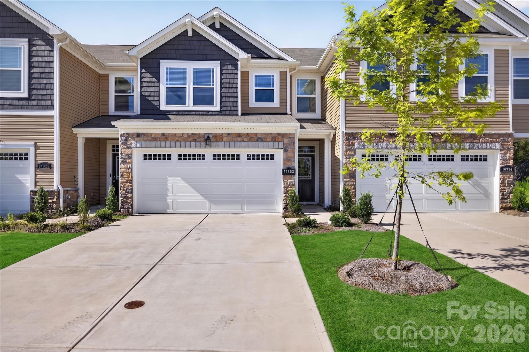 Welcome to this beautifully designed town-home in the desirable community of Porter's Row in Steele Creek.
The spacious main level features a bright family room that flows seamlessly into the kitchen, complete with a large center island, granite countertops, stainless steel appliances, a walk-in pantry, and an inviting dining area—perfect for entertaining or everyday living. A convenient drop zone with built-in storage and an attached two-car garage add both style and functionality.

Upstairs, the private owner's suite offers a generous walk-in closet and an en-suite bath, while two additional bedrooms, a full bath, and an upstairs laundry room provide comfort and convenience for family or guests. One of the secondary bedrooms includes a space-saving Murphy bed that conveys with the property, offering added flexibility for guests, a home office, or a multi-purpose room. As an added bonus, all appliances convey with the home, making this property truly move-in ready.

Enjoy outdoor living on the rear patio overlooking a peaceful tree-lined backdrop. Residents of Porter's Row also benefit from lawn maintenance and community amenities, including sidewalks, walking trails, and picnic areas.
Ideally located just minutes from I-485, Lake Wylie, McDowell Nature Preserve, Charlotte Premium Outlets, Carowinds, dining, and entertainment, this home combines low-maintenance living with exceptional convenience. Don't miss your opportunity to own this move-in-ready town-home in one of Charlotte's fastest-growing areas.