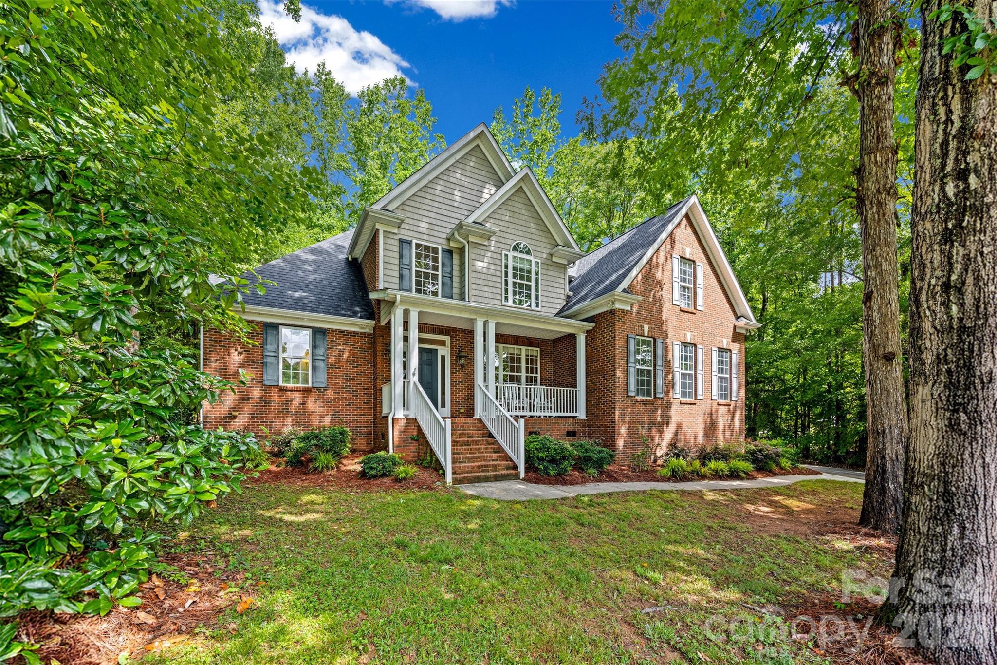 Full Brick custom home in Patrick Place. Private lot on cul-de-sac street. Master bedroom on main level with triple tray ceiling. Master bathroom has whirlpool tub, double vanities & separate shower. Office on main level that can be used as bedroom with full bathroom-perfect for in laws. Kitchen with  cherry cabinets, island & stainless steel appliances. Main floor has beautiful hardwood floors. Spacious 2-story great room with gas fireplace. Two nice sized bedrooms upstairs. Huge bonus room can be 5th bedroom or media/playroom. Back yard backs up to wooded area-very private. New roof June 2026! New upper floor HVAC 2026! Award winning Clover schools. Convenient to shopping & the YMCA.