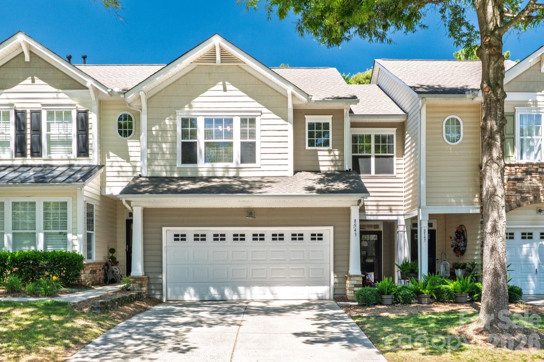 Beautifully appointed townhome in amentity rich Highland Creek with a TWO car garage! Updated LVP flooring leads you through the main level offering a spacious living room with cozy gas log fireplace, while the large dining area provides the perfect space for entertaining. The well-equipped kitchen boasts granite countertops, black & stainless steel appliances, tile flooring, a raised breakfast bar, and a separate pantry for ample storage. A convenient powder room completes the main floor. Upstairs, you'll find an oversized primary suite highlighted by a tray ceiling and a private balcony overlooking the private rear yard. The beautiful primary bath features a dual vanity with lots of storage, decorative mirrors, garden tub, separate shower, and an expansive walk-in closet. Two additional bedrooms, ample in size with nice closet space and a dedicated laundry room round out the upper level. * Recent updates offer peace of mind and modern appeal, including new luxury vinyl plank flooring, new carpet, fresh interior paint, HVAC replaced in 2022, water heater replaced in 2023, and a new roof installed in 2024. Additional features include an expanded patio with a covered area and open space area which backs to the wooded common area, ceiling fans in all bedrooms, crown molding in living & dining and 2 inch blinds. Although it has a Charlotte address, this home is located in the Cabarrus County section and pays only COUNTY taxes! * Highland Creek is known for the amazing amenities which include a golf club w/ 18 hole course, beer garden & taproom, 4 swimming pools, 2 clubhouses, fitness center, basketball court, tennis, pickleball, walking trails, recreation areas, 4 playgrounds, frisbee golf and endless events and activities. It is also located near tons of shopping, dining, coffee, entertainment and is quick access to I-485, I-85, I-77, approx 25 min to Charlotte Douglas Airport and approx 10 min to Concord Regional Airport.