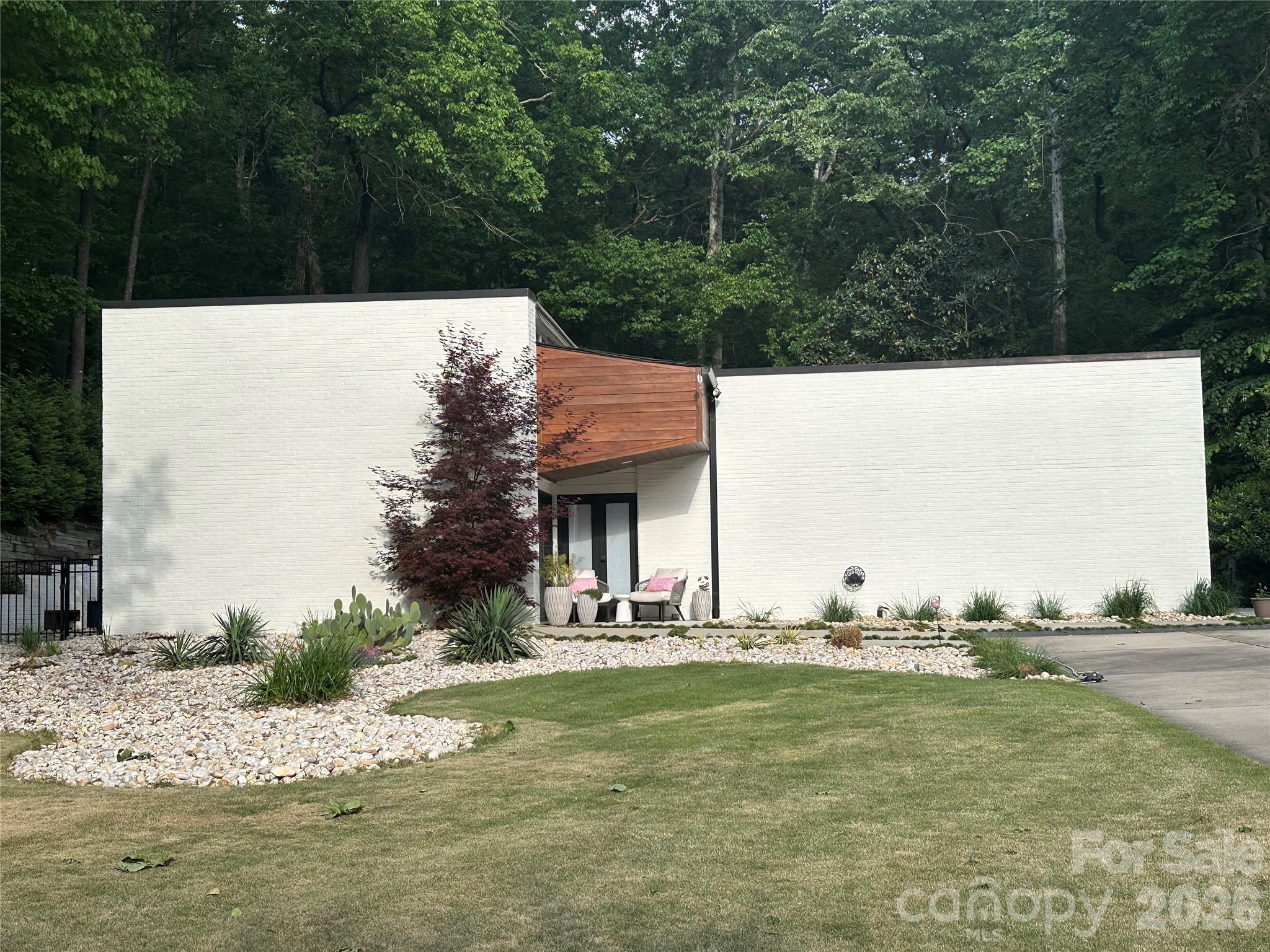 Welcome to this stylish modern home in the highly sought-after Mountainbrook neighborhood of South Charlotte! Offering 2,409 heated square feet, this beautifully updated residence features clean lines, contemporary finishes, and an open, light-filled layout perfect for modern living.
Enjoy a fully fenced private backyard – an ideal oasis for relaxation, entertaining, or play. Nestled among the mature trees and winding streets of Mountainbrook, this home combines the peaceful, family-friendly charm of an established community with convenient access to top-rated schools, SouthPark Mall, Phillips Place, dining, and major highways.
Mountainbrook is known for its strong sense of community and tree-lined appeal. Don’t miss this rare opportunity to own a modern gem in one of Charlotte’s most desirable South Park locations!