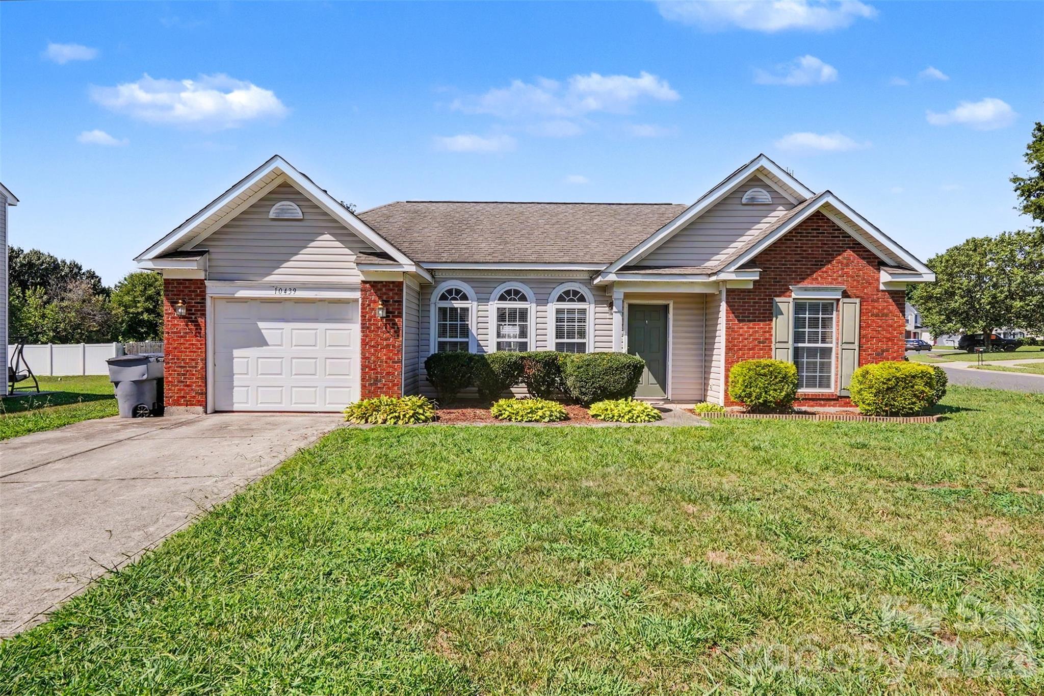 Welcome to this charming ranch-style home perfectly situated on a spacious corner lot in one of Charlotte's northside communities. This well-maintained 3-bedroom, 2-bath residence offers comfortable one-level living with an inviting open floor plan designed for everyday living and entertaining.
The spacious Great Room features cathedral ceilings and a cozy gas log fireplace, creating a warm and welcoming gathering space. The adjoining kitchen is equipped with ample cabinetry, a breakfast bar, pantry, spacious countertops with tile backsplash making meal preparation convenient.
The private primary suite offers a relaxing retreat with a walk-in closet and an ensuite bath complete with a separate shower and luxurious garden tub. Bedrooms two and three are connected by a convenient Jack-and-Jill bathroom.
Step outside to enjoy the fully fenced backyard featuring an extended patio—perfect for outdoor dining, grilling, or relaxing. The corner lot provides additional yard space. New Water heater 2026, Dishwasher approx. 2022. Oversized 1 car garage, 2"blinds refrigerator remains. 
Whether you're looking for your first home, downsizing, or simply seeking the convenience of single-story living, this move-in-ready home offers the perfect combination of comfort, functionality, and outdoor space. Schedule your showings today! This would make an ideal rental investment.