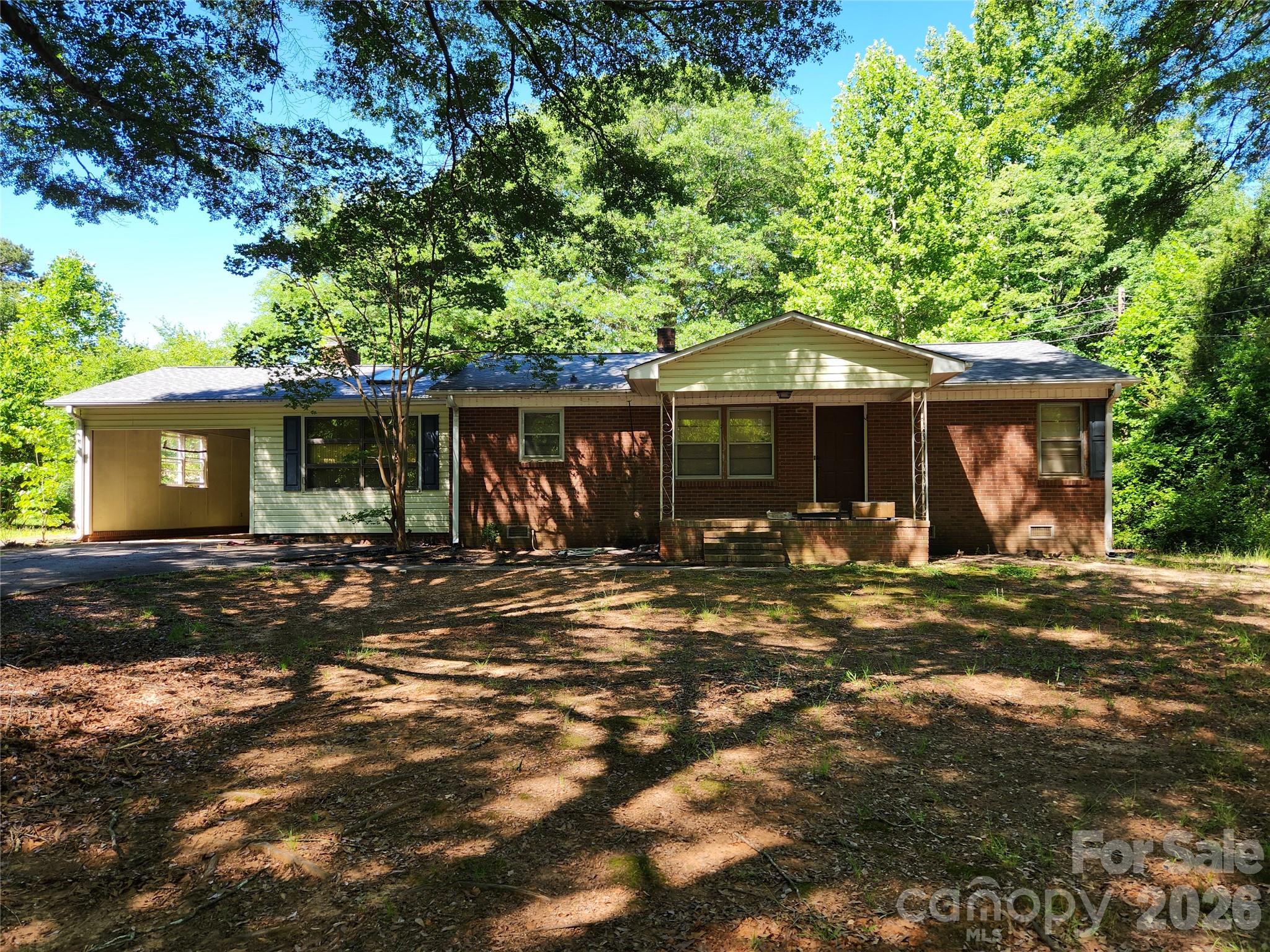 Welcome to your dream country retreat in Lincolnton, North Carolina! This charming 3-bedroom, 2-bathroom ranch-style home sits beautifully on a spacious, flat one-acre lot surrounded by majestic, mature trees that offer exceptional privacy and shade. Perfect for hobbyists, mechanics, or creators, the property features a massive detached workshop fully equipped with its own dedicated electrical power meter. Inside, the classic single-level floor plan offers easy, accessible living with a bright den, and a peaceful primary suite. Enjoy quiet Carolina evenings on your large back deck overlooking your expansive, private backyard.

Handyman special, needs some updates and priced accordingly.