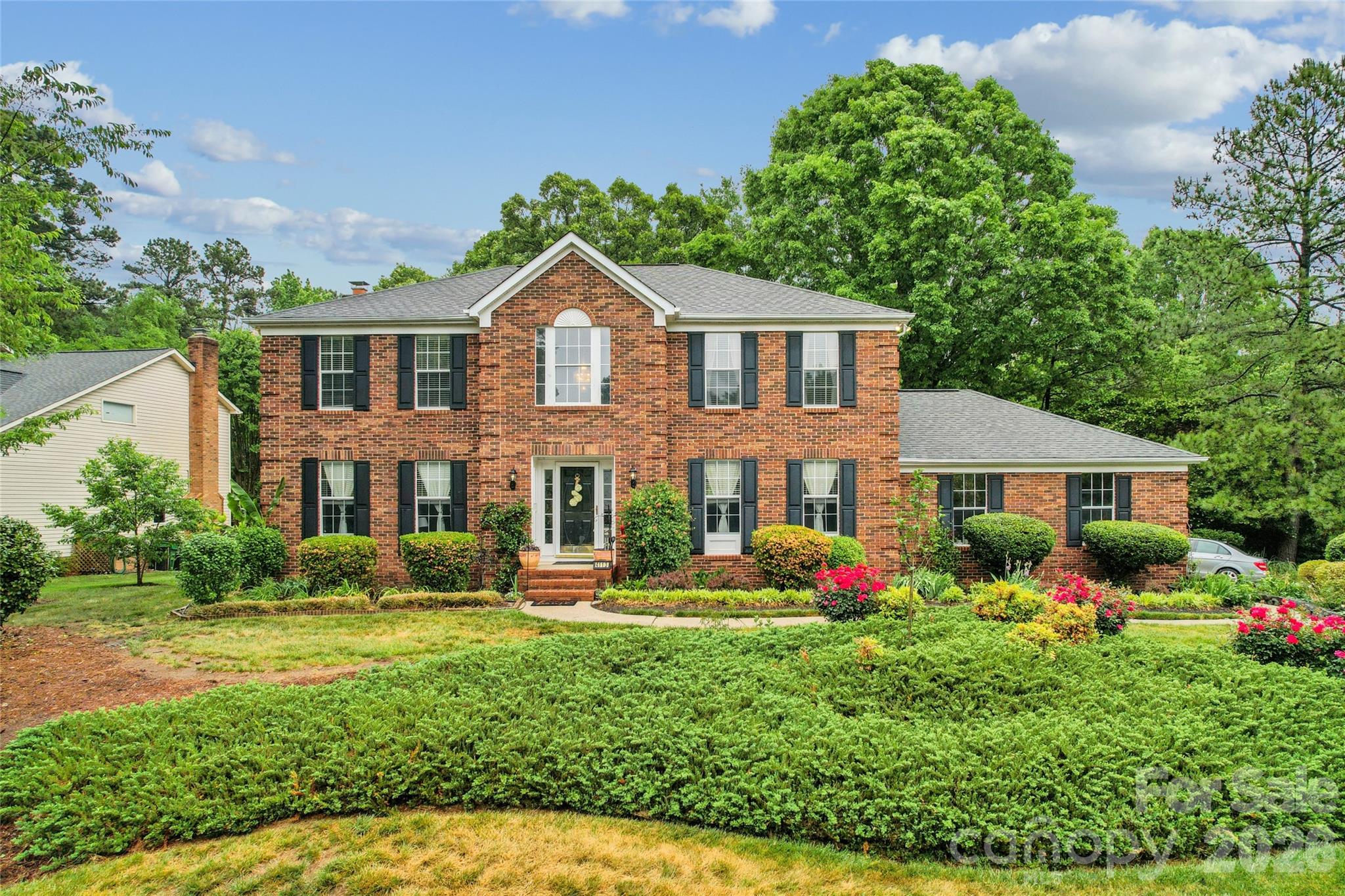 Charming and well maintained home on a beautiful corner lot in the highly desirable community of Winchester! This spacious home offers 4 bedrooms, 3.5 baths and sunroom added in 2024 (all with permits).  It provides wonderful versatility and may be used as a main-floor bedroom.  It has its own full bath. As you enter, you will find an inviting foyer, beautiful wooden floors, granite countertops, stainless steel appliances and a cozy fireplace that adds comfort and character to the family room. On the upper floor, you will find 4 large bedrooms and 2 full renovated baths.  Primary bedroom has walk-in closet with built ins.  Outdoor living shines with a welcoming wraparound porch with double patio areas and peaceful pond with water feature—perfect for relaxing or entertaining. This home has been well maintained over the years and there is a list of improvements done to it.  Including a partial encapsulation of the crawl space.  The community offers fantastic amenities, including an outdoor pool, tennis and pickleball courts, playground, plus direct access to the fabulous Clarks Creek Greenway. Conveniently located near shops and restaurants, just 15 minutes from Uptown Charlotte, 2 minutes from I-485 and about 5 minutes from I-77 and I-85. And, best of all, it is KEY READY!!!