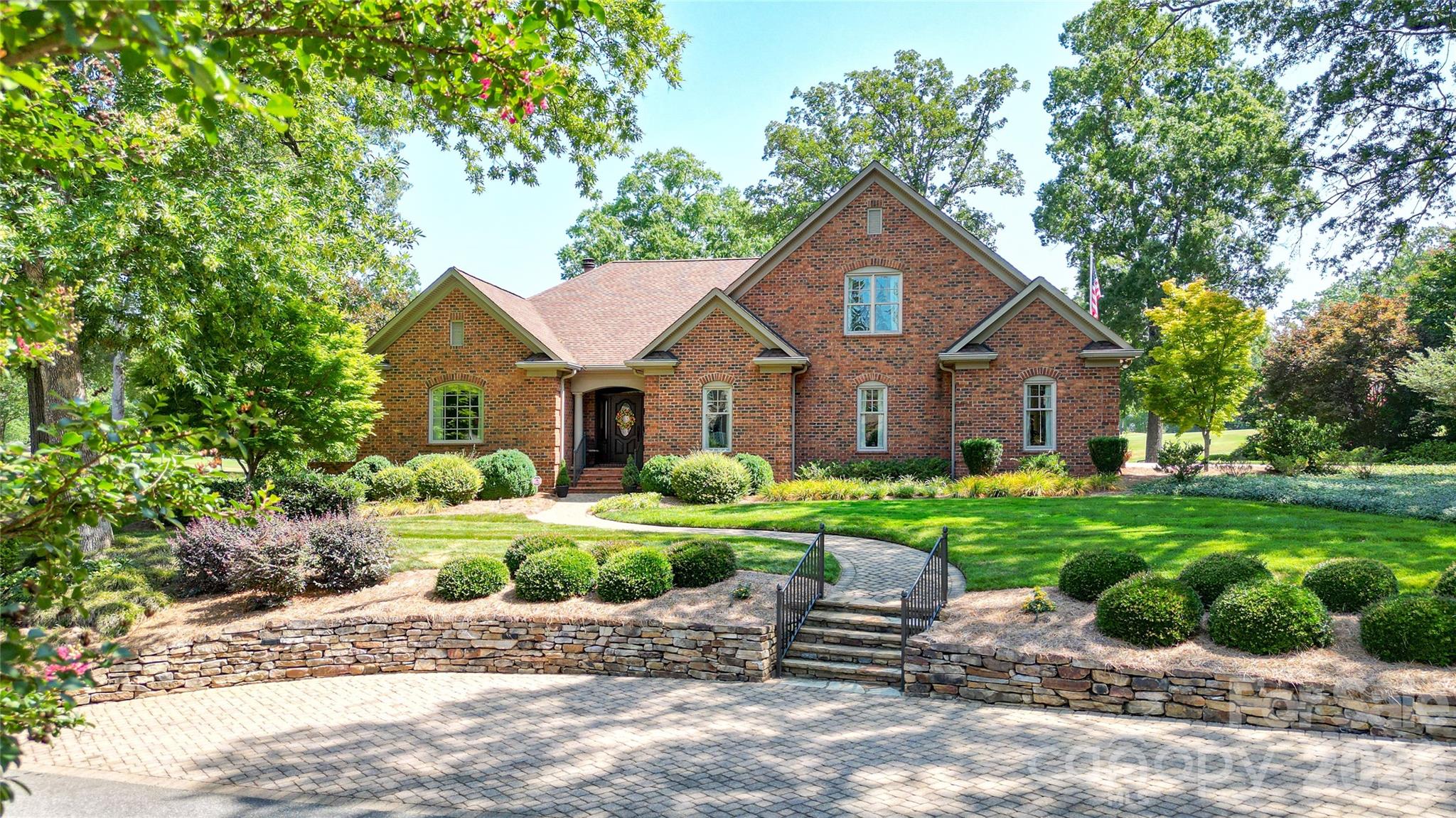 North Road Circle is a unique opportunity to live on a Salisbury Country Club cul-de-sac with no older homes.  The 3 homes that face this street are all newer construction (original homes were razed and new homes built). This location on the golf course offers a panoramic view of the amazing Donald Ross Course that remains in demand for serious golfers. This home has everything to offer!  Amazing views, an open floor plan, a potential 4th bedroom (if you add a closet or armoire to the exercise room). In addition to the primary ensuite on the main level, this would provide an additional bedroom and full bath on the main level for guests. The large primary BR offers a tray ceiling, doors to the inviting, covered back porch and his and hers walk in closets. Primary BA boasts spacious step in shower, dual sink areas, jetted tub, heated towel rack and water closet with modern bidet toilet. Main level living area is open and amazing with beautiful views of the lovely deep covered porch with built-in gas grill and the #4 fairway of the golf course directly behind. There is a large dining area, very large kitchen with amazing custom hickory castled cabinets, breakfast bar, granite counters, veggie sink, warming drawer, double ovens, built-in microwave, Thermador gas cooktop and so much more! The great room has amazing built-ins on the sides of the inviting and super attractive granite surround gas log fireplace. One built-in includes a wet bar! The office is so handsome and has attractive office furniture that was designed just to fit in that room (remains with home). Upstairs there are two large bedrooms with a huge walk-in closet between the two. There is an entrance to one side of the walk-in attic in that closet and in the hall an entrance to an extremely gracious walk-in attic with fabulous storage! Interior stairs are wide and attractive. The landscaping all around the house is professional with full irrigation and is very impressive. There is a parking pad in the front of the house with stone stairs that lead to the walkway to the front door. The front porch is covered with room for chairs. Garage has 2 car bays and a third pay for a golf cart. There is a sink, fridge and tool storage also in garage. Additional incredible features include tankless hot water heater, whole house vacuum, whole house generator & sound system throughout the house (including the back porch)!No worry about your pets with invisible fencing too!