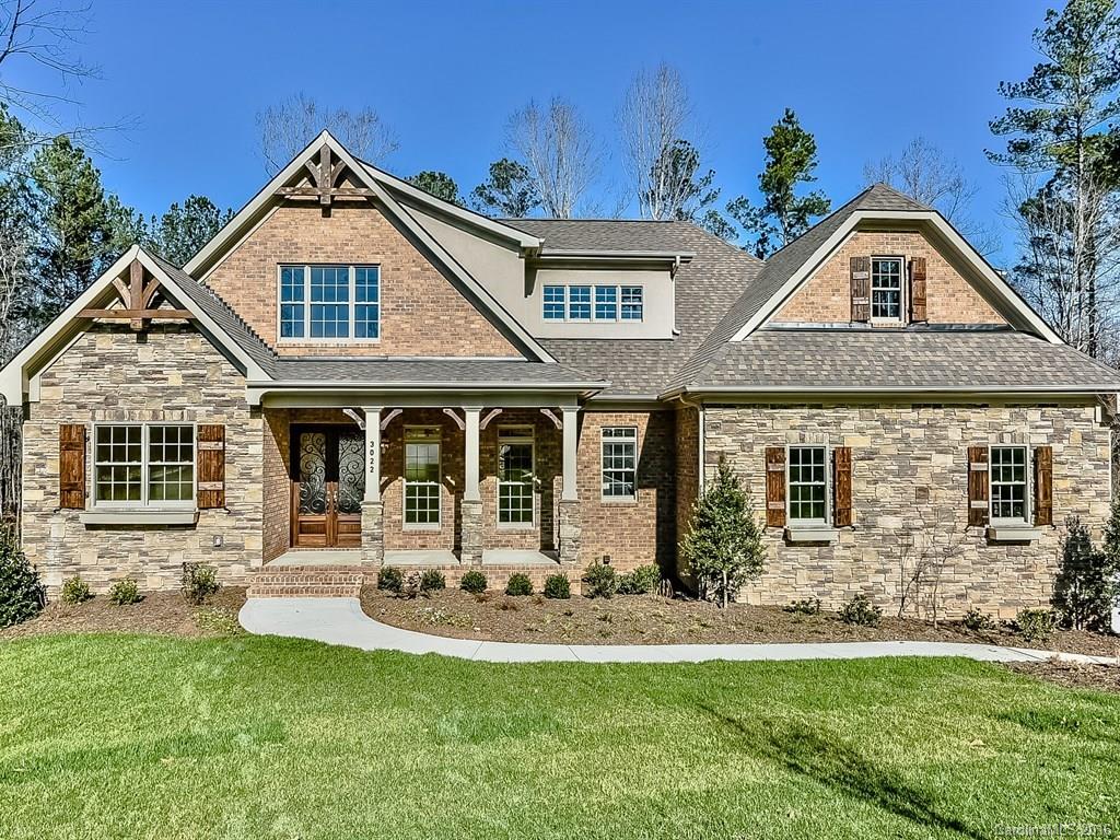 European design in Fort Mill's most coveted community from a top custom home builder.  4,228 sq ft, 5br/4.5ba with a 1,815 sq ft unfinished basement. Master on main, large master closet with built ins, walk in deluxe shower.  Hardwoods in formal areas, kitchen, and foyer.  Gourmet kitchen with custom cabinets, stainless steel appliances and Sub Zero Refrigerator. Basement can be finished.  Built ins, covered porch, deck with outdoor kitchen, 3.5 car garage, covered pool w/spa.  A dream home!!!