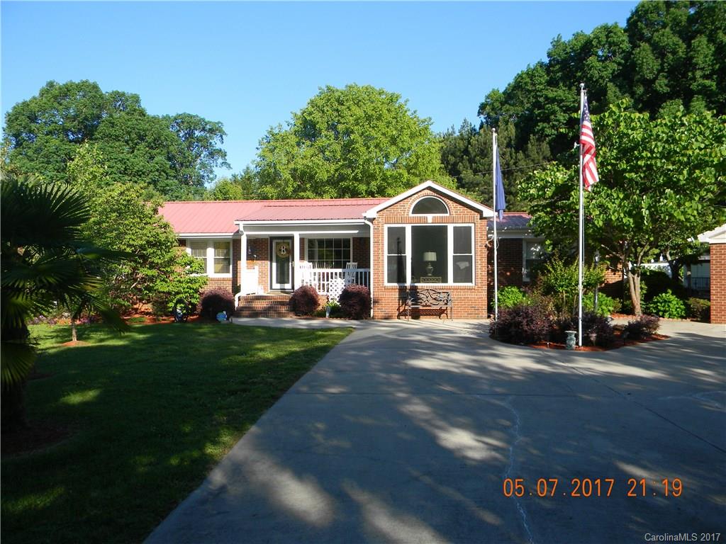RARE FIND!!! Don't miss out on this beautiful 2 bd/2bath brick ranch home.This home was remodeled 2005 and features an open floor plan with custom cabinets in the kitchen, updated bathrooms, sunroom, deck, patio, fenced in backyard, metal roofing, wired workshop, 2 car carport w/ storage attached and much more. Sunroom was added in 2009. The property is abundant w/ pecan trees, palm trees, grape vines and immaculate landscaping.