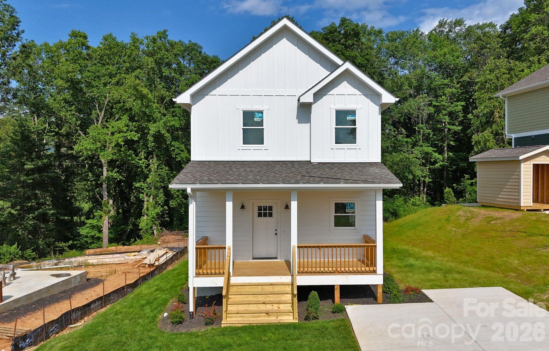 Brand-new construction in South Asheville! Welcome to 33 Loblolly Lane in Biltmore Terrace, a walkable community of thoughtfully built homes. This Energy Star–certified 3BR/2BA residence features an open floor plan with white oak hardwood floors, granite countertops, and custom tile bathrooms.  The kitchen is equipped with stainless steel Samsung appliances and flows seamlessly into the spacious living and dining areas—ideal for everyday living and entertaining. Enjoy long-range mountain views from both the front and back decks.  Located just minutes from Biltmore Village, downtown Asheville, and the Blue Ridge Parkway, this home offers both convenience and lifestyle appeal. Benefit from low county taxes (no city taxes). Short-term rental potential—buyer to confirm.
Interior photos are of a similar home with the same floor plan and finishes.