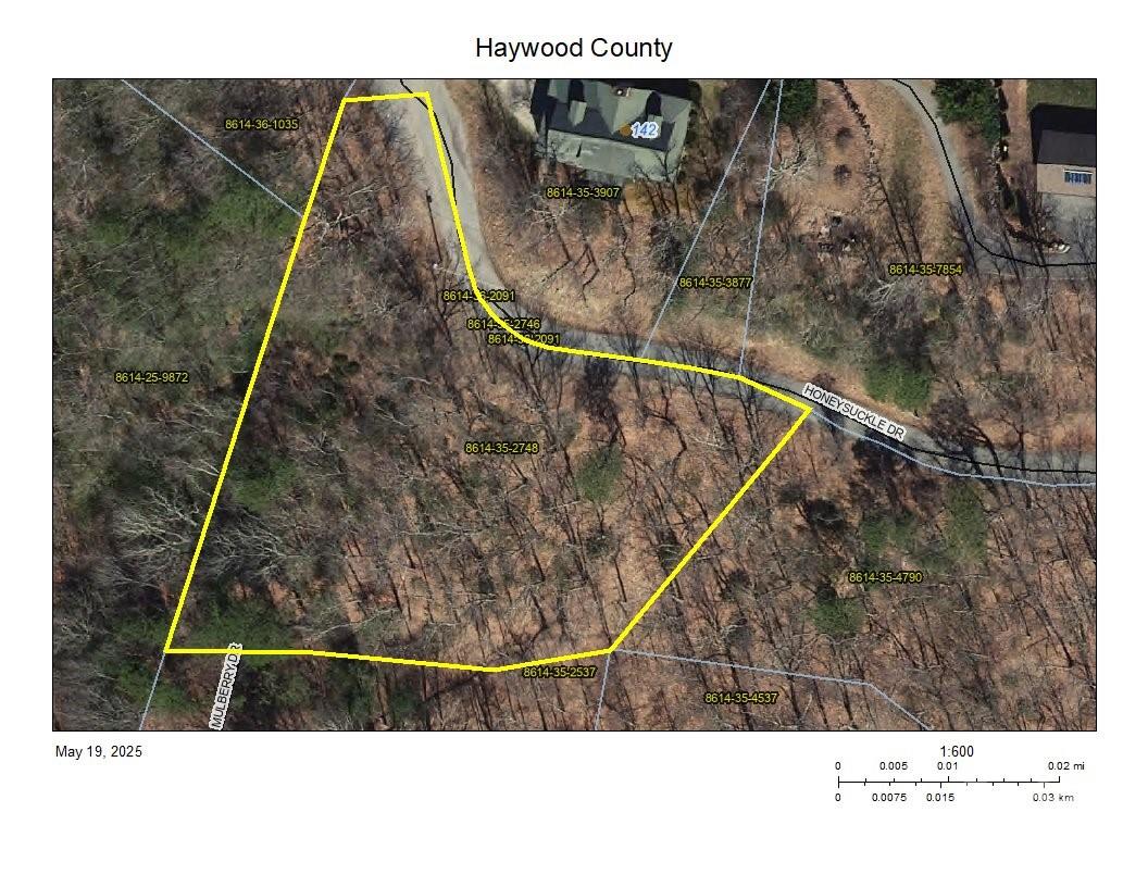 Lot is located in the Smoky Mountain Retreat at Ridgewood Estates.  Situated at the end of Honeysuckle Drive almost at the ridgetop of the development.  Year-round fantastic views to the southwest. The Smoky Mountain Retreat at Ridgewood Estates is served by the Town of Waynesville and provides public paved road / maintenance, water, sewer, trash pick-up, police and fire department protection.  Lot is listed below the tax-value for a quick sale!