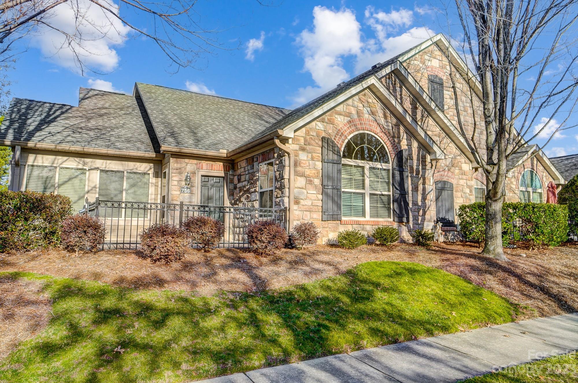 Welcome home to this lovely condo in Stonecrest Villas of Tega Cay offering zero step entry and a attached 2 car garage.  Open floor plan with large kitchen- tons of countertop and cabinet space. This layout also is sought after because of its double primary bedroom design both with full baths- one having a shower/tub combo while the other has a walk-in shower, both offering walk in closets. Relax in the tiled sunroom with lots of natural light or enjoy the fireplace in the main great room on those cozy evenings.  Dining area, kitchen and great room all open and makes for an easy flow. New tiled floors in laundry-mud room, kitchen and entryways. All appliances convey with washer, dryer and dishwasher being new.  This highly desired neighborhood offers, sidewalks, street lights, club house, pool, fitness. Located near shopping, restaurants, medical and I-77. Low SC taxes & award winning schools!
HOA DOES NOT ALLOW FHA or VA FINANCING. CASH OR CONVENTIONAL FINANCING ONLY.