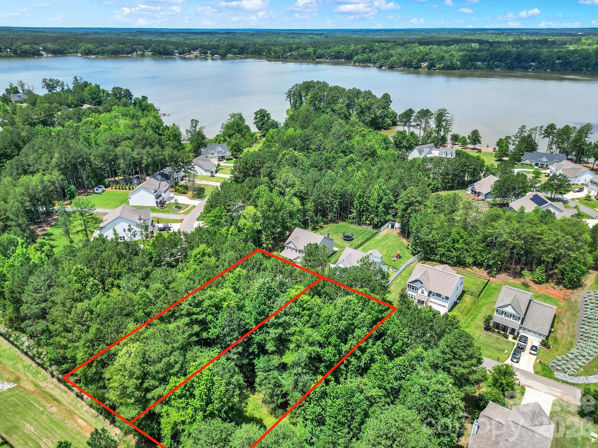 Great opportunity to own an oversized DOUBLE LOT (previously two lots, 61 & 62) that were combined into one parcel. Customize and build your dream home with your own builder or work with one of Edgewater's approved professionals, subject to architectural guidelines and square footage minimums. Nestled on a private, cul-de-sac street, Edgewater offers an 18 hole golf course, putting green, clubhouse with restaurant, outdoor pool, tennis & pickleball courts, walking trails, Marina with boat slips/storage, and community events & activities. With access to 3,300-acre Fishing Creek Lake, you will fall in love with all that Edgewater has to offer. Minutes to downtown Lancaster and a short drive from Charlotte, NC, Rock Hill & Columbia, SC.