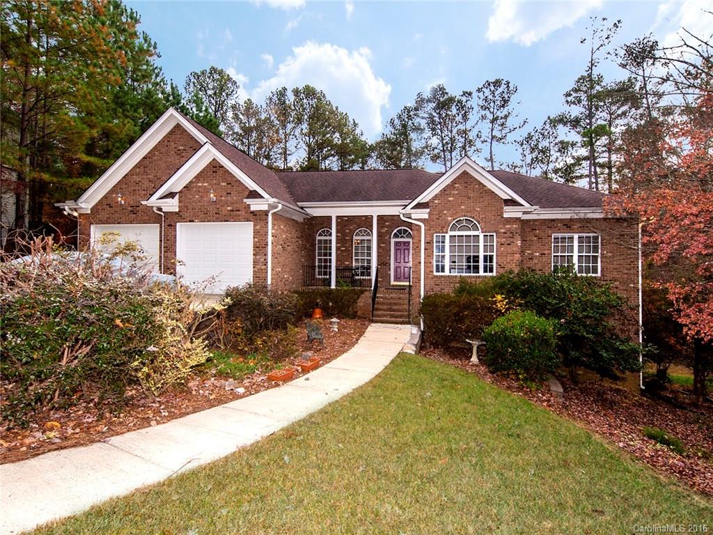 Custom Built ranch with finished Basement in award winning Fort Mill School District in Tega Cay.  Private wooded lot on cul-de-sac close to Lake Wylie.  Open Split floor plan with 9' ceilings upstairs and down.  Large basement with flex areas,storage,workshop, and large entertainment area. Granite and Glass Backsplash in kitchen. Counter Bar. Breakfast area with bay window. Huge Deck and screened porch overlook a private, wooded backyard.