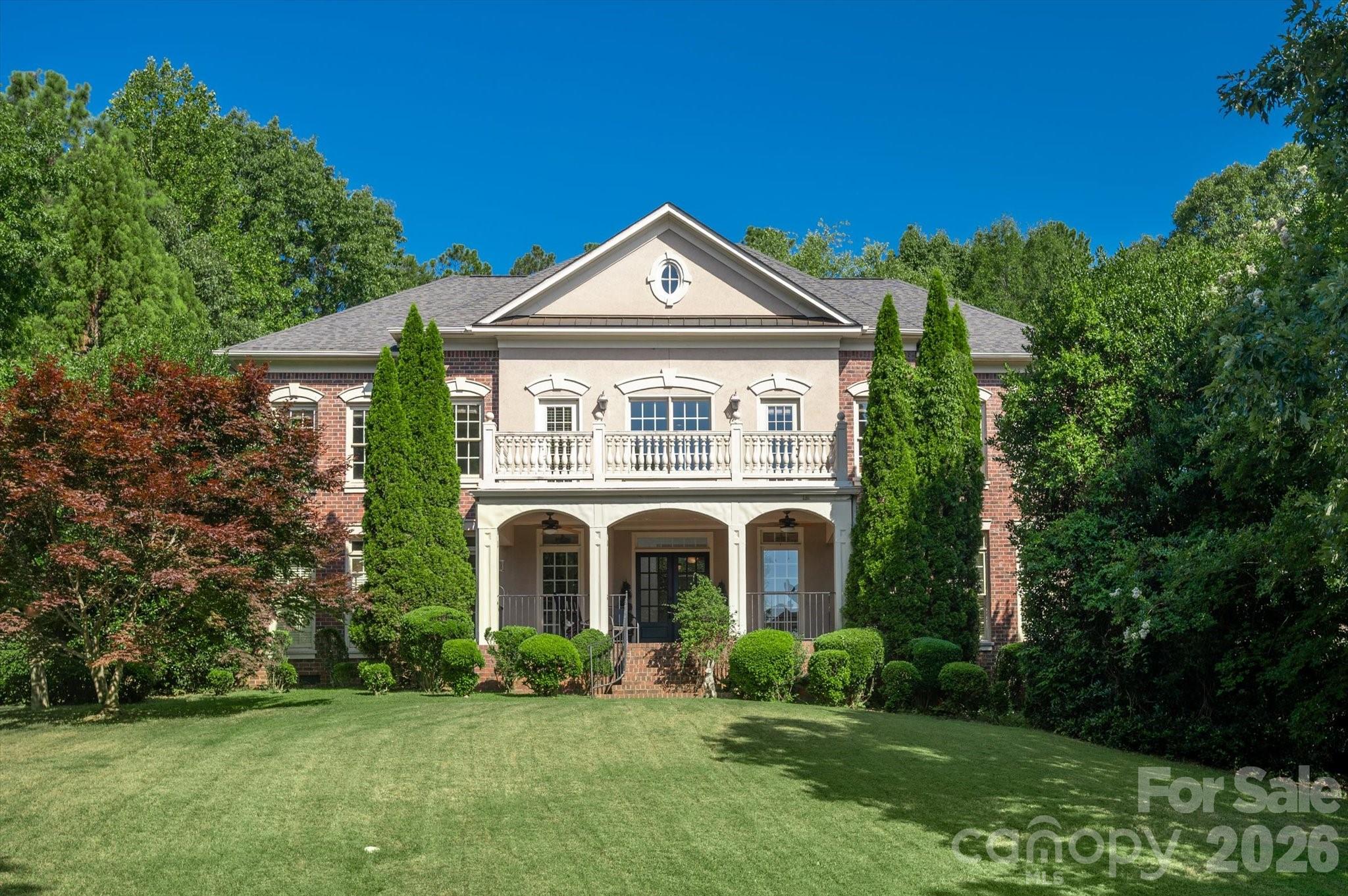 Location is everything when you experience the best of south charlotte living in this stunning 3 story brick home a minute away from luxurious Ballantyne amenities. Ideally located on a quiet cul-de-sac in highly sought after Ballantyne Country Club west. Enter into a 2 story foyer with 20 foot soaring ceilings flooded with natural light. The massive wall of windows command your attention in a 2 story great room with a cast iron and crystal chandelier. The great room, kitchen and breakfast rooms are defined by views into your own private luscious backyard oasis. A sparkling swimming pool with 9 foot deepend, tiered stone waterfall, elaborate stone work, mature landscaping, grape and berry bushes create your own paradise designed for ultimate relaxation and entertaining. The spacious master suite with tray ceilings is complete with 2 walk in closets, large bathroom with vaulted ceilings. Suite like third floor provides a unique combination of media room and guest accommodations. Enjoy the perfect balance between country club living and urban conveniences, The Bowl at Ballantyne/Ballantyne Village, the soon to open Wegmans grocery store, and close proximity to 485 make this amazing gem of a home easily accessible to the greater CLT area.