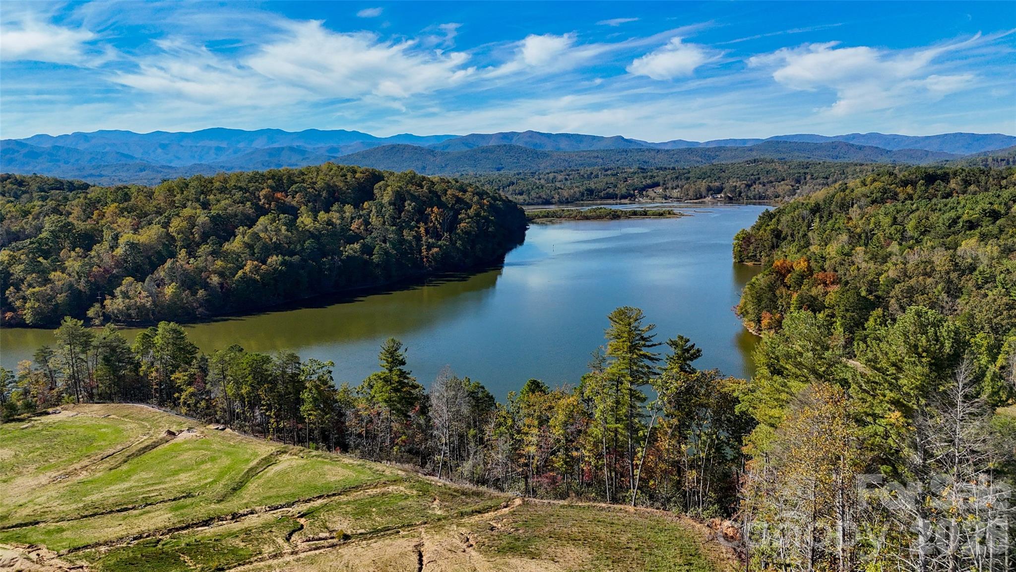 Discover Lot 109, a highly desirable deeded lot in The Reserve at Barefoot Landing on Lake James, offering beautiful long-range water and mountain views in a premier recreational community. Set within a thoughtfully planned 34± acre gated development with over 2,800 feet of pristine shoreline, this property provides an exceptional setting for a private lake retreat.  Lot 109 is part of an exclusive 142-lot community designed for both enjoyment and long-term value. Owners benefit from access to amenities at the sister community, Barefoot Landing on Lake James, including an outdoor pool, bathhouse, and laundry facilities. Future enhancements include a planned 113-slip marina, reviewed and approved by Duke Energy and the Federal Energy Regulatory Commission (FERC), in accordance with Duke Energy’s Shoreline Management Plan.  Ideal for a lake cottage or RV use, Lot 109 combines scenic beauty, resort-style amenities, and a rare ownership opportunity on Lake James. Secure your place in this sought-after lakeside destination and start enjoying the mountain and water views you’ve been dreaming of.