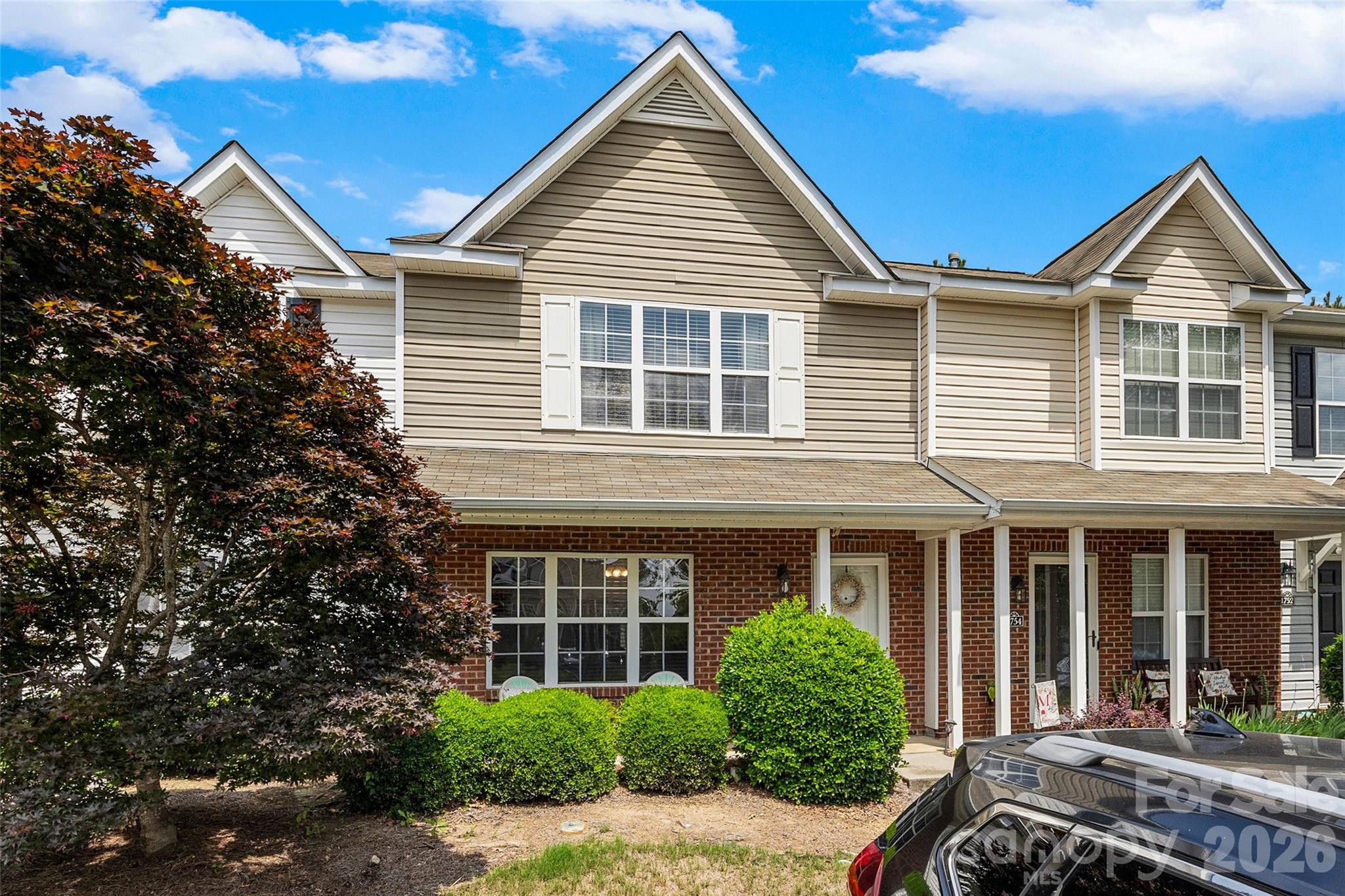Welcome home to low-maintenance living in one of Rock Hill's most convenient locations! This beautiful townhome offers the perfect blend of comfort and functionality!  The spacious main level features a seamless flow between the large living room and dining area.  The kitchen offers beautiful granite countertops, a center island, and great pantry storage, Upstairs, you'll find two generously sized bedrooms, each featuring its own private en-suite bathroom and walk-in closet, providing comfort and privacy for family members or guests alike. A convenient main-level laundry room and abundant storage throughout the home add to its practical appeal.  Step outside to enjoy the fenced backyard, offering a private outdoor retreat perfect for relaxing, entertaining, or letting pets play. Residents enjoy access to the community pool and the convenience of being just minutes from I-77, shopping, dining, healthcare, and everything Rock Hill has to offer.  Whether you're a first-time buyer, downsizing, or looking for an investment opportunity, this move-in-ready townhome is one you won't want to miss!
