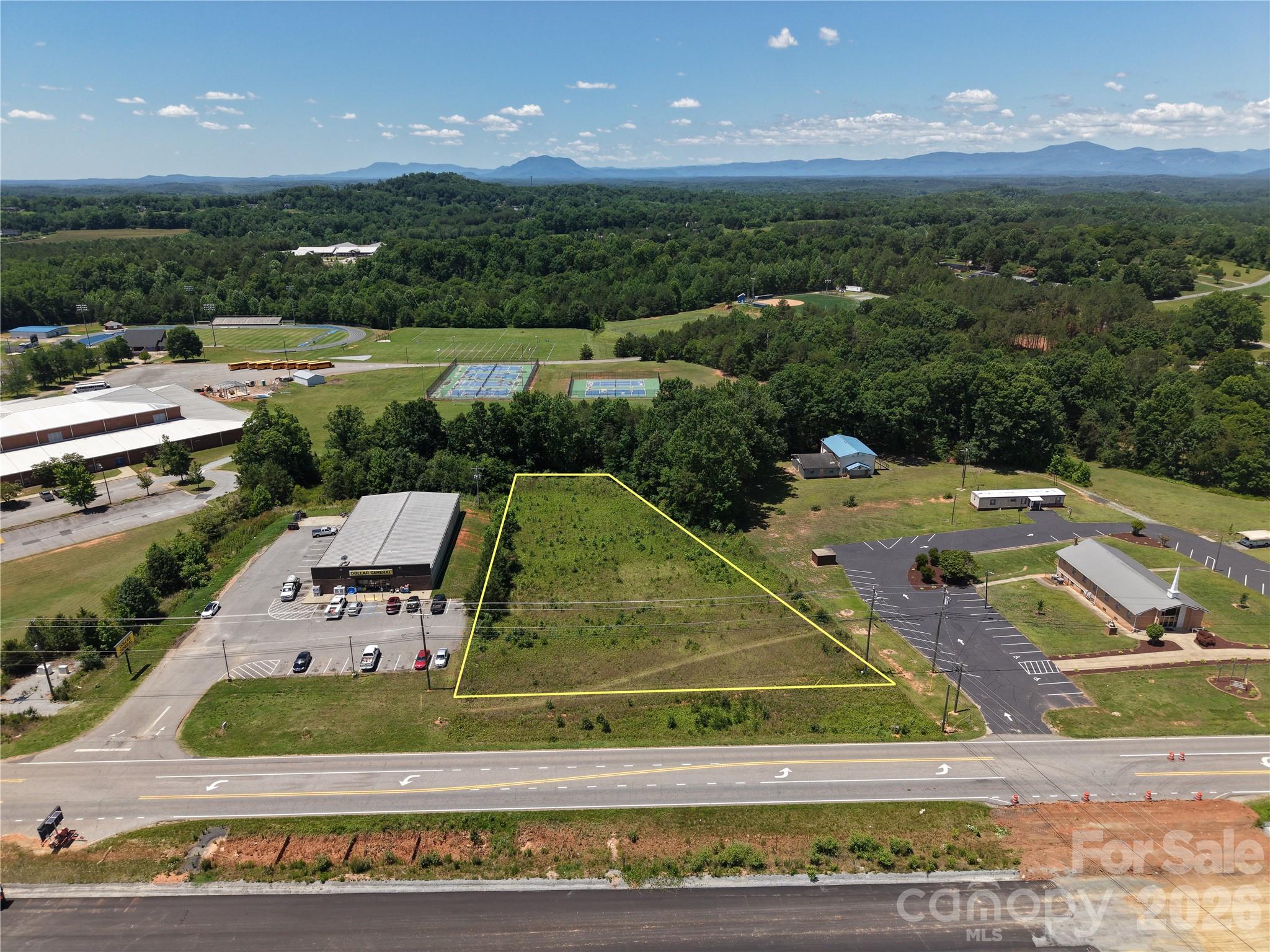 Excellent opportunity to own 1.8 acres on highly visible US Highway 221N in Rutherfordton! This vacant parcel offers approximately 1.8 acres with road frontage along a well-traveled corridor, providing easy access and excellent exposure. Conveniently located near R-S Central High School, Gold Hill Church, and just minutes from downtown Rutherfordton.
Whether you're looking for a future homesite, investment property, or potential development opportunity, this property offers a great combination of location and accessibility. No improvements currently on site, allowing buyers the flexibility to create their own vision. Enjoy the convenience of highway access while remaining close to shopping, dining, schools, and area amenities.
Buyer to verify zoning, permitted uses, utilities, acreage, road frontage, and any development requirements.