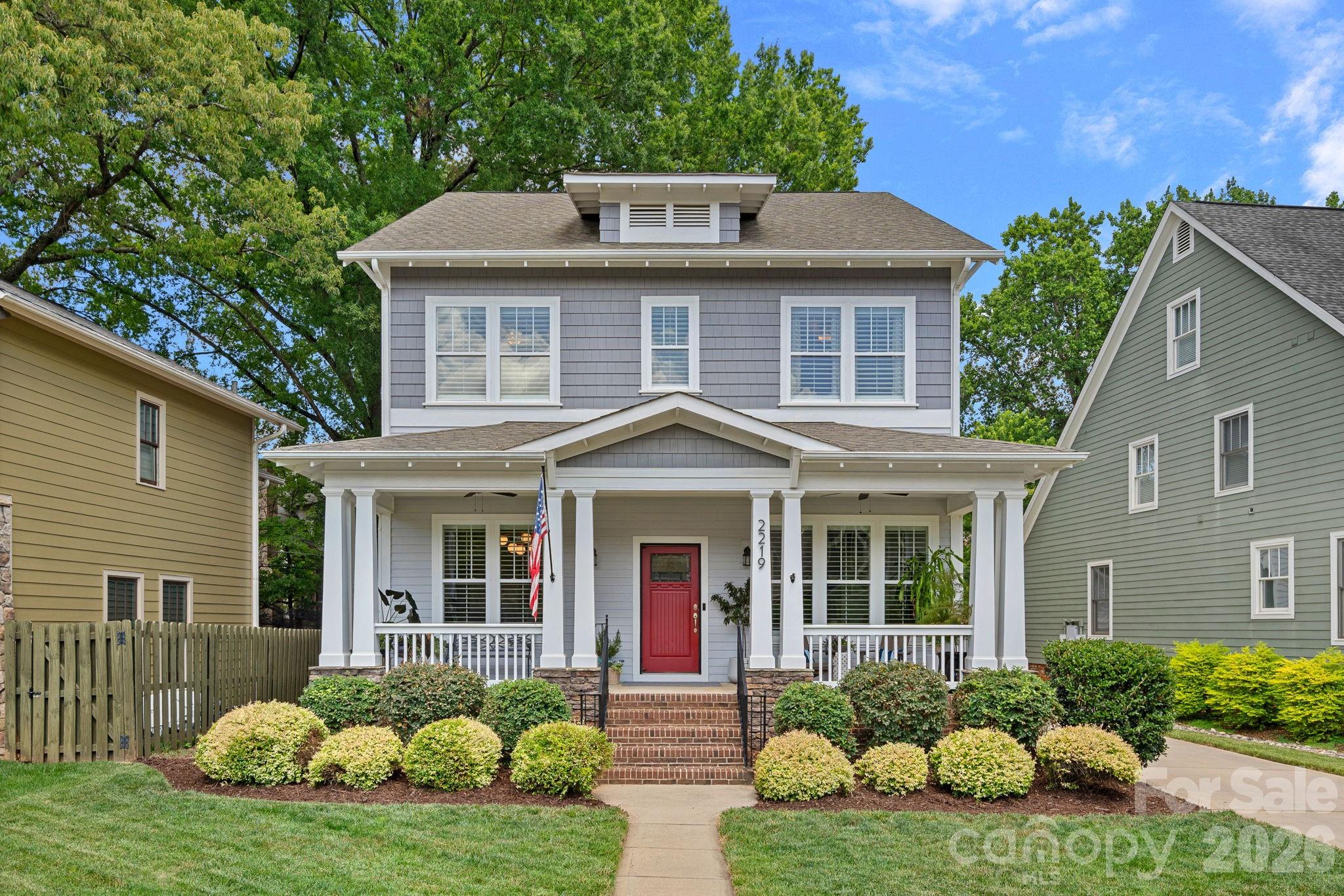 This beautifully updated Dilworth Craftsman blends timeless character with modern style in one of Charlotte’s most sought-after walkable neighborhoods. A welcoming front porch invites you to enjoy warm summer evenings, while the unbeatable location puts restaurants, parks, and shops just steps from your door. At the center of the home, the renovated kitchen showcases a striking navy island, an eye-catching orange Bertazzoni gas range, tiled wall with open shelves, and seamlessly flows into the dining area and family room with a cozy fireplace. Tall ceilings and beautiful hardwood floors throughout the first and second levels enhance the home's light-filled, spacious feel and classic appeal. The main level also features a spacious dining room and a private office with French doors, offering the perfect work-from-home setup. Upstairs, the generous primary suite offers a luxurious retreat with a stunning ensuite bath, while two additional bedrooms provide flexibility for family and guests. The third-floor bedroom/bonus room with a full bath creates even more versatility as a guest suite, media room, or workspace. Step outside to your private backyard oasis, complete with a pergola-covered hot tub, tranquil fountain, and space to relax year-round. A detached two-car garage adds convenience and additional storage. Combining classic Craftsman charm, thoughtful updates, and an unbeatable walkable Dilworth location, this exceptional home delivers the best of Charlotte living.