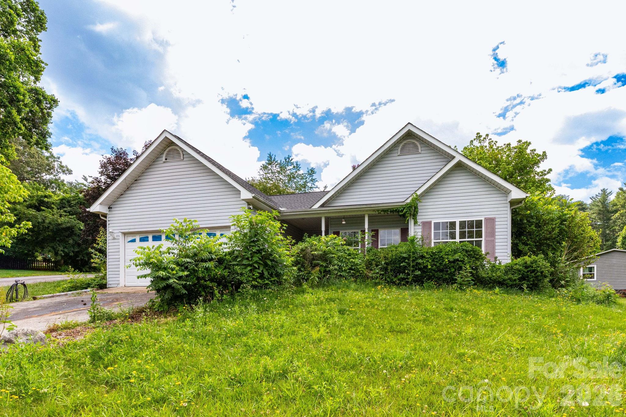 Rare opportunity for experienced investors and renovators ready to unlock serious value in a prime South Asheville location. Originally built in 2002 and sold only once — as a brand new home — this single-level 3-bedroom, 2-bath property sits on a generous 0.68-acre corner lot just off Mills Gap Road and is hitting the market for the first time in over two decades.

The bones are solid and the floor plan is compelling: 1,805 square feet of single-level living with a cathedral ceiling in the living room, tray ceiling in the primary suite, large eat-in kitchen with a walk-in pantry, ample closet space throughout, and a 2-car attached garage. Outside, a level, fenced backyard with shed, covered front porch, and a large corner lot with significant upside once the landscaping is addressed.
This property requires substantial renovation — including plumbing, interior finishes, and landscaping — and is priced accordingly. It is being sold strictly as-is. Buyers should conduct thorough due diligence and come prepared for a full renovation scope.

For the right investor, the fundamentals here are hard to find at this price point: single-level layout, 2-car garage, nearly three-quarters of an acre, and a location with strong long-term value. The potential is real — it just takes vision and the willingness to do the work.

Proof of funds or lender letter required with all offers. Please see agent remarks for offer instructions.