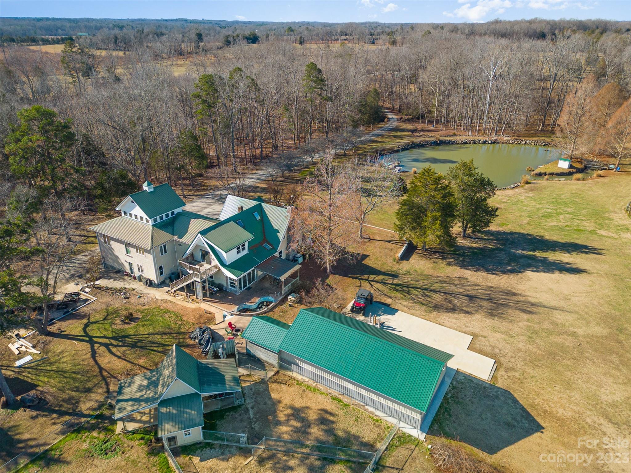 Incredible home, land, farm acreage & beautiful location! This property has it all! Currently used as beef cattle farm, the possibilities are endless. 20 miles of fencing, 23 garage parking bays - many w/garage doors, (attached garage is 1,311 sq ft), heated dog building + runs, 3 wells, motor home connections, greenhouse, garden areas, excellent 600 MB internet, stocked fishing pond, separate stair entrance to 2nd floor from garage. Home is lovely w/all wood & tile flooring, updated kitchen w/new appliances & granite, rocking chair front porch, lots of beds, baths & spaces for all activities. Closed in area in mud room w/separate range & sink for over-flow cooking. Living room is large & very attractive w/built-ins. Gas log fireplace in LR & in 3rd floor room. Primary BR on main level w/2 baths & lots of closet space. Amazing panoramic view from so many areas of house. Super convenient location (near HWY 70 w/access to I-40, I-77 & I-85). Opportunity! Also listed as farm MLS 4095309.