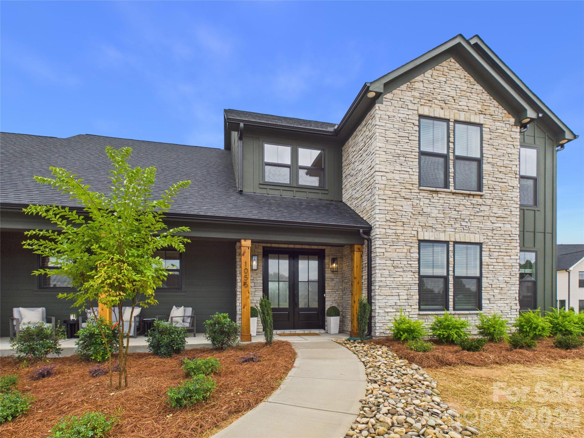 Stunning new construction on a 1-acre homesite in Mooresville. This semi-custom designed 4 bedroom, 4 bath home offers just under 4000 square feet of thoughtfully crafted living space and an impressive 1,191 square foot 3-car garage. The open-concept floor plan features a gourmet kitchen with high end KitchenAid appliances including a professional range and an expansive island. The main level primary suite is a true retreat with a spa-inspired bath featuring a luxurious wet room with a freestanding tub and oversized walk-in shower. Enjoy seamless indoor-outdoor living with the inviting front porch and two covered patios out back. Flexible spaces including a spacious bonus room upstairs and an office on the main level. Circular driveway, 2-story foyer, abundant natural light, and exceptional attention to detail throughout. Rare opportunity to own a newly completed luxury home on an acre in a highly desirable location - 12 minutes from downtown Mooresville and 5 minutes from Carrigan Farms. More photos coming soon!