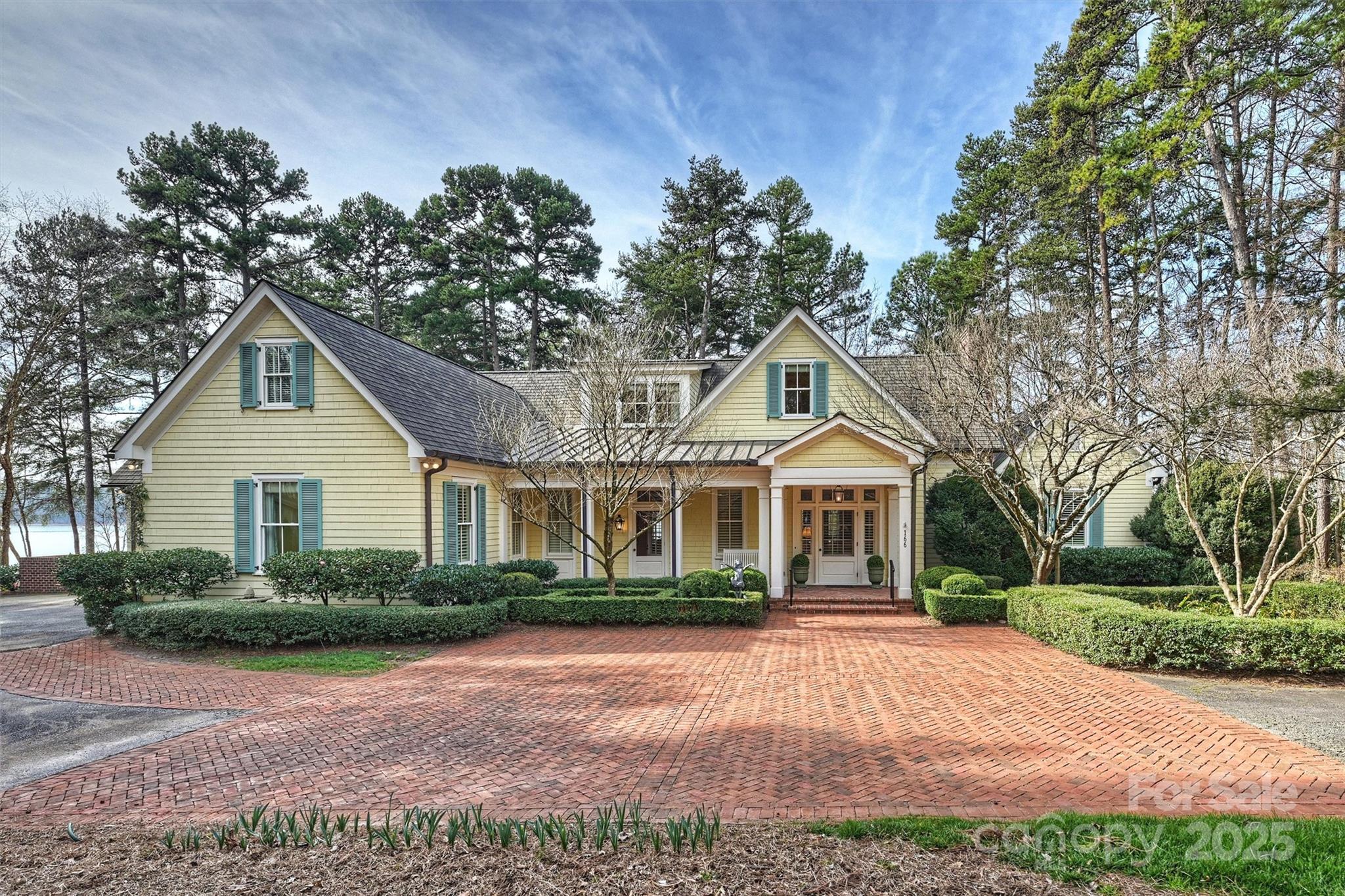 Presenting a breathtaking timeless residence with 300 feet of Lake Norman shoreline, designed by renowned Architect Duffy Magas & Associates for luxurious lakeside living with ultimate privacy. This 4,987 sqft retreat offers 4 bedrooms (3 bedrooms on the main floor all with en-suites), 6.5 baths, & endless spaces for entertaining inside and out. The exterior features include a private gated entrance, an extremely large screened in porch, wood burning fireplace, built in grill and absolutely stunning views of Lake Norman. The backyard is an entertainers dream with a beautiful double dock with long range channel views, outdoor shower and space to add a pool. Inside, stunning heart of pine floors from New Hampshire lead to an open floor plan with impeccable craftsmanship. This is a MUST SEE in person and only 25 miles to Charlotte, yet you feel you are a world away!