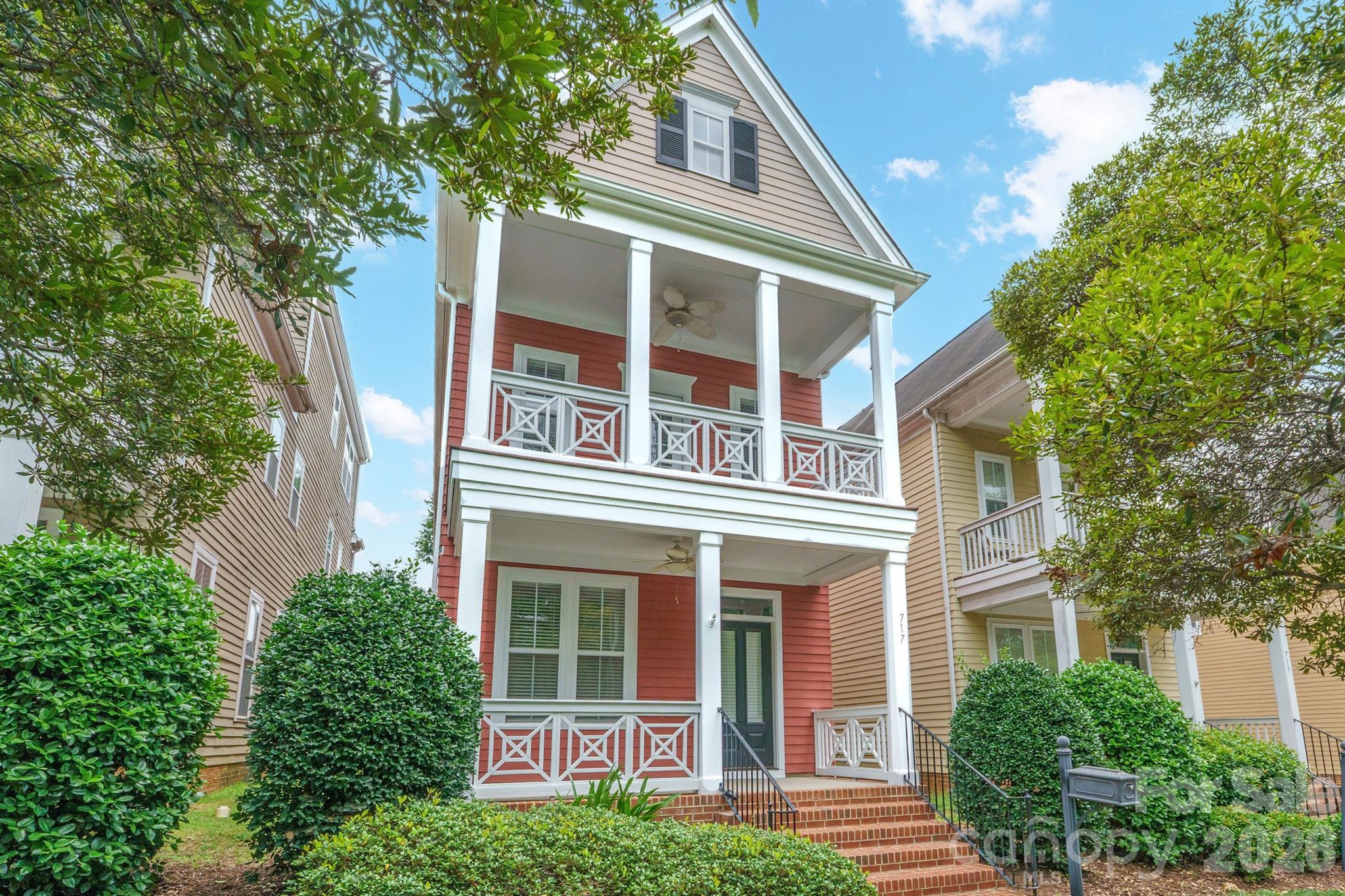 Rare Uptown living with the warmth, privacy, and character of a single-family home. This Charleston-inspired residence in First Ward offers the best of both worlds: a vibrant city location just minutes from restaurants, parks, entertainment, sports venues, light rail, and Uptown amenities, paired with inviting living spaces, outdoor areas, and a detached 2-car garage. Inside, you’ll find an open main level designed for everyday living and easy entertaining, featuring hardwood floors, a comfortable living area with a gas fireplace, and a well-appointed kitchen with granite countertops, stainless-steel appliances, and an oversized island that naturally becomes the gathering spot. Multiple porches and a balcony create the perfect place to unwind, enjoy morning coffee, or take in the Uptown view. The flexible three-level layout provides room for guests, work-from-home space, or a private retreat, while the fenced yard offers a rare outdoor escape in the heart of the city. With classic curb appeal and a location that puts Charlotte at your doorstep, this home delivers a lifestyle that is hard to find and easy to love.