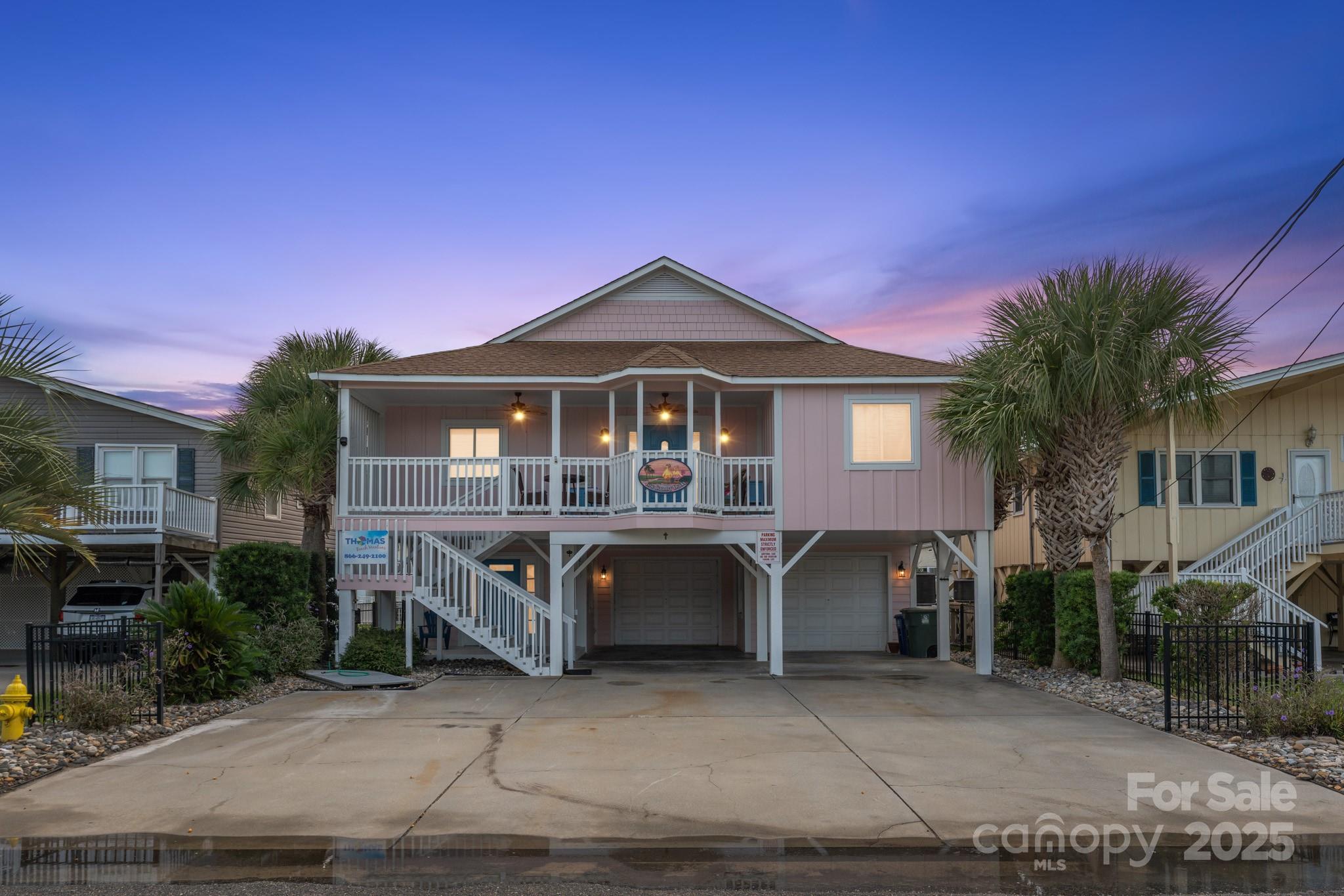 The Cherry Grove Canal Camelot. Experience true coastal luxury located directly on the Cherry Grove Canal with impeccable views of the water, your very own private dock, separate kayak dock, outside shower, and dual level deck on the water side. Inside of this home you will find every bit of luxury you would expect to include unique touches in each room. The home was totally updated in 2022 to include new hardboard siding, new back deck with Azek decking and wrought iron balusters, full bathroom remodels, new fans, new light fixtures, new blind system in sunroom, new paint, flood proofing of the laundry room, new flooring, new sod, and new waterproofing of the docks. This property has been beautifully landscaped to include 14 large palm trees. The canal was dredged in 2023 and is plenty deep for docking a mid-size boat to use the open access to the inlet and ocean from the canal. Located just 1.5 blocks from the ocean, you truly must come and see this oasis for yourself.