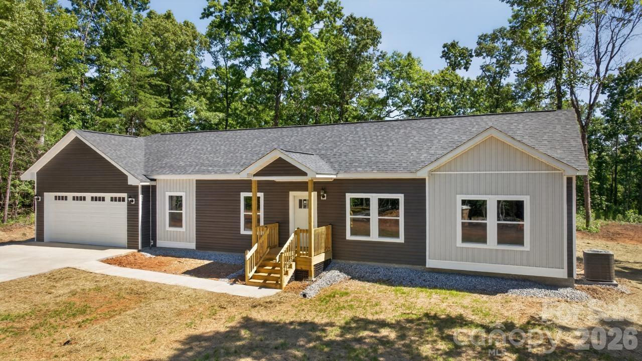 New construction in Green Creek. Beautiful new three-bedroom, two-bathroom ranch home situated on 2.27 acres of level usable land.  Enjoy privacy and peaceful surroundings while benefiting from the modern construction and thoughtful design throughout.  This home features 9-foot ceilings, a spacious open floor plan, granite countertops, a center island and stainless-steel appliances.  Relax outdoors on the 10 x 16 deck or the welcoming 6 x 8 covered front porch.  Additional highlights include a two-car, insulated garage with an oversized door and encapsulated, crawlspace.  Quality finishes throughout. The mostly level acreage offers endless possibilities for gardening, recreation or simply enjoying the outdoors. Conveniently located near the Columbus/Tryon area and close to Boiling Springs South Carolina.  It is approximately 30 miles from Asheville Regional Airport and only 3-4 miles from Interstate 26.