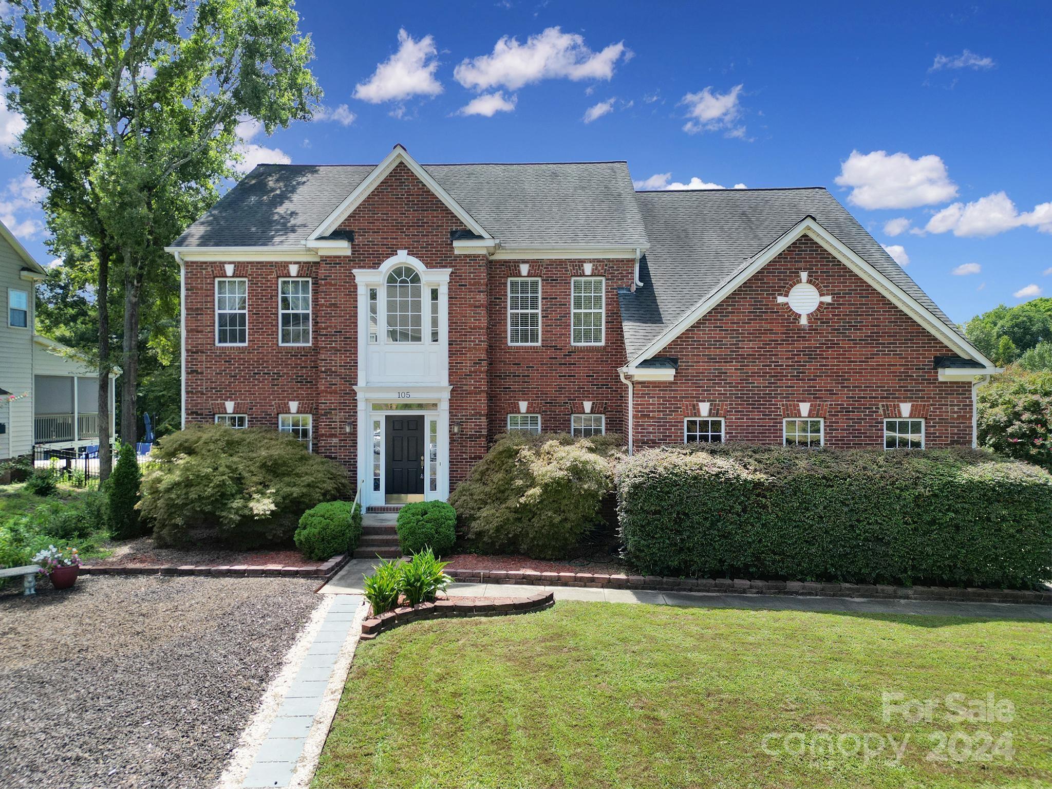 Welcome to this charming brick front home, situated on a large corner lot w/ a side load garage. The updated kitchen boasts stainless steel appliances, granite countertops, & a spacious butcher block island. The sunroom & morning-room feature vaulted ceilings & large picture windows, allowing natural light to flood the open floor plan. The sunroom & family room share a see-thru fireplace, while the family room features a built-in bookcase & bay window. The naturally lit foyer leads to the office or guest room, full bathroom, formal living & dining rooms, leading to a screened-in porch & patio. Upstairs, the primary has a tray ceiling, walk-in closet, & ensuite w/ a garden tub & shower. Four additional bedrooms & a full bathroom with double sink & linen closet complete this spacious home. Freshly painted walls, refinished hardwood floors & staircase, with new carpet make it ready for your personal touches.