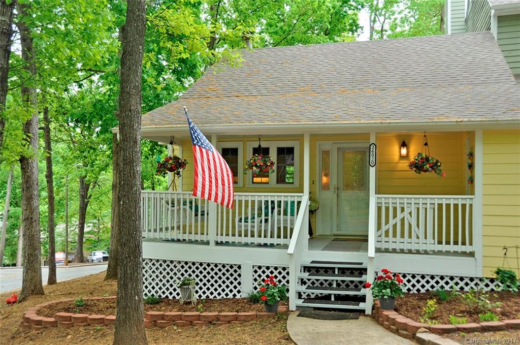 Adorable End Unit w/Shared Dock, Seasonal Water View, Large Front Porch, 2 bd/2.5 bth, This townhouse has been updated beautifully. The custom kitchen features granite countertops, floating island, stainless appliances lots of cabinets, pantry. The great room has a large fireplace and access to a spacious deck. The master has sliding doors leading to a covered patio, master bath with great shower and walk-in closet. Too many upgrades to mention! Meticulous! Enjoy All Tega Cay has to offer!