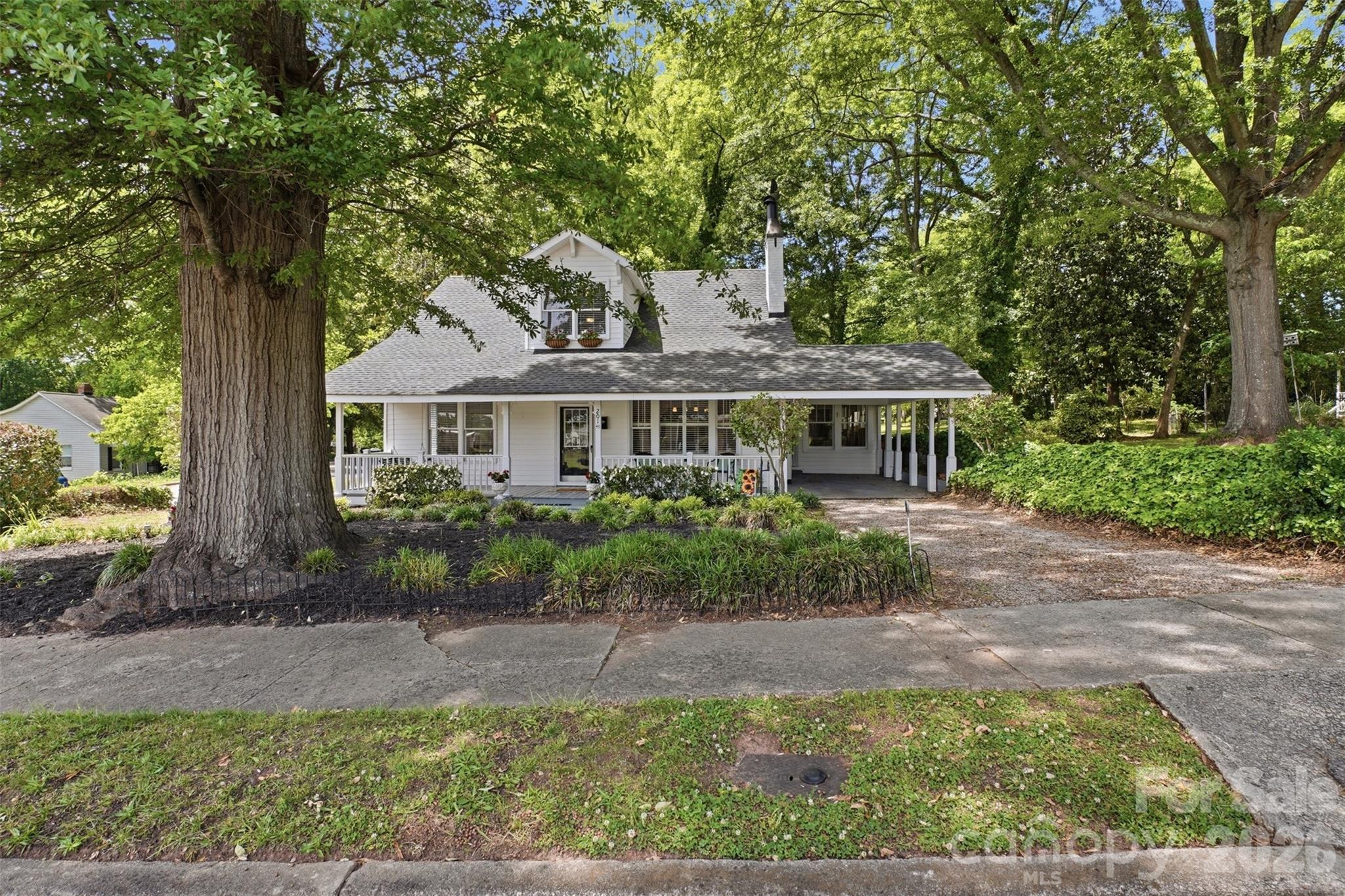 Not every home tells a story—this one has been telling one for over 100 years. Full of personality and original character, this property stands apart from today’s cookie-cutter homes. Beautiful hardwoods stretch through the living spaces and bedrooms, while fresh interior paint throughout gives a bright, move-in-ready feel. Set beneath mature trees, the shaded lot offers a peaceful backdrop with space to enjoy from the oversized front porch, cozy sunroom, or back deck ready for your personal touch. Major updates include roof replacement and HVAC in 2016, offering peace of mind while preserving the charm and history that make this home truly special. 

For added confidence, the home is covered by a transferable home warranty through the first 12 months of ownership.