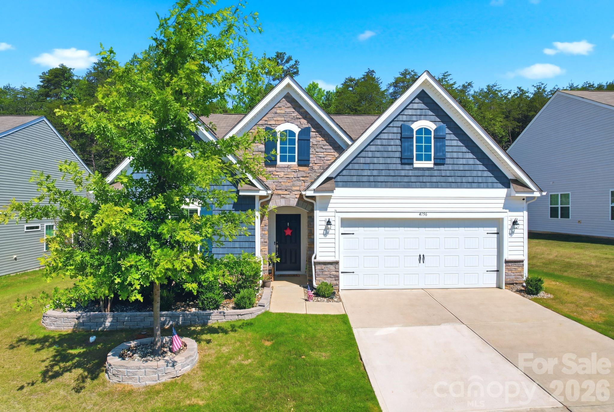 Why purchase new construction at a higher price when you can have a nearly new home that's already complete with premium upgrades? Less than three years old and located in a sought-after community, this move-in-ready home offers everything buyers love about new homes—plus the valuable extras that builders don't include.

Inside, you'll find a bright, open floor plan featuring durable luxury vinyl plank flooring throughout the main living areas and bedrooms, tile flooring in the baths and laundry, elegant plantation shutters, and a stunning white kitchen with quartz countertops, ample cabinetry, and modern finishes. Every detail has been thoughtfully selected, making this home truly turnkey.

Step outside to enjoy a fully fenced backyard that backs to a private wooded area, creating a peaceful setting instead of looking at your neighbor's house. Relax year-round on the screened porch, gather around the custom fire pit, and appreciate the professionally upgraded landscaping that adds beauty and curb appeal from the moment you arrive.

With all the finishing touches already in place, you can skip the added expense, time, and hassle of installing fencing, window treatments, landscaping, and outdoor living spaces after closing. Conveniently located with easy access to Uptown Charlotte, this home combines the appeal of new construction with the comfort, privacy, and upgrades that make it even better.

Alarm system and cameras will stay with the home and remaining security contract transfer is available to the new owner. Ask for details.