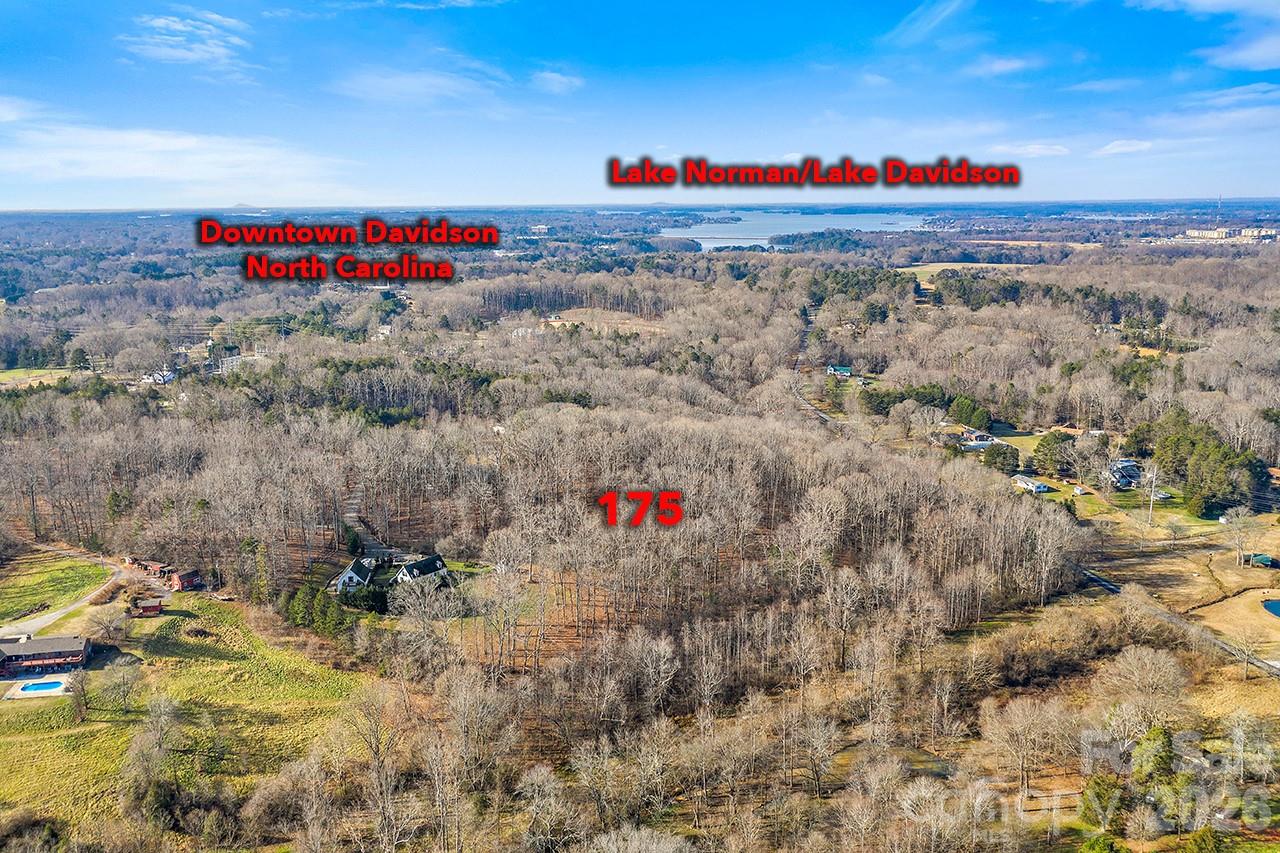 Beautiful 7.5-acre estate just minutes from downtown Davidson, offering exceptional privacy and endless outdoor possibilities. Ideal for equestrian use, a small hobby farm, or anyone seeking room for recreation, lake toys, and future barns or outbuildings. Enjoy the luxury of space while staying close to the best of the Lake Norman lifestyle—parks, water activities, dining, shopping, and convenient access to Charlotte. A rare opportunity to own a versatile property in a highly desirable location. Property lines on photos are approximate and not exact.