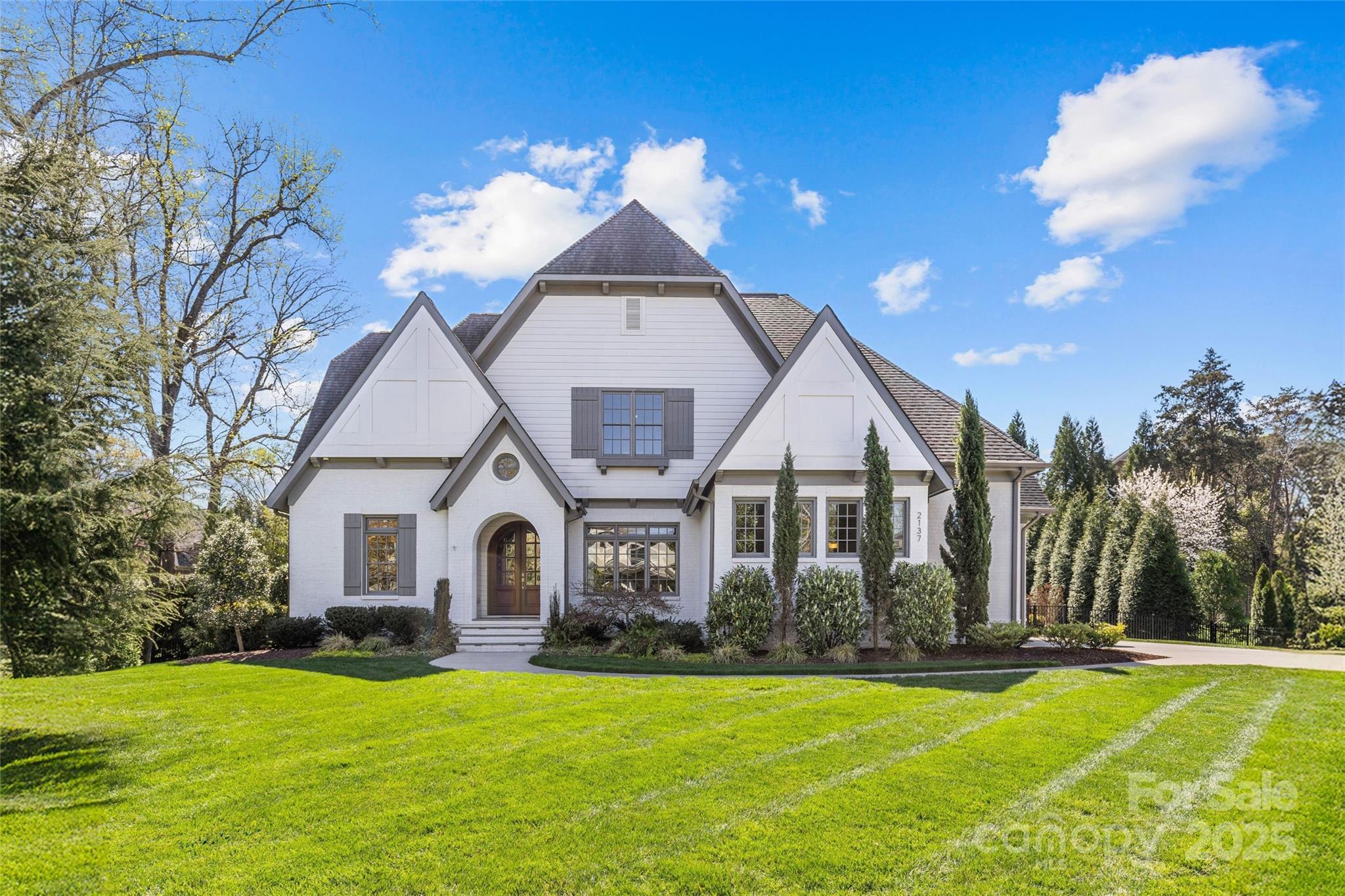 LUXURY LIVING IN FOXCROFT WOODS!  This spectacular home exudes luxury and sophistication.  Desirable floorplan for effortless entertaining and everyday living.  Show-stopping chef’s kitchen with island and walk-in pantry open to spacious fireside living room with coffered ceiling and sunny breakfast area.  Dining room, powder room and study with built-ins.  Primary suite with vaulted ceiling on main with ensuite bath with double vanity, shower, soaking tub and walk-in closet.  Laundry room, drop zone and full bath (near pool area), also on main.  Four additional bedrooms, three full baths, bonus room, flex room and study niche with built-in desks, upstairs.  Extend entertaining outdoors on the covered porch, overlooking the beautiful saltwater pool, hot tub, private backyard with firepit and trail.  Parking for three in attached garages.  Lots of storage space in walk-in attic.  Convenient to shops and restaurants in both the SouthPark and Myers Park areas and easy commute to Uptown.
