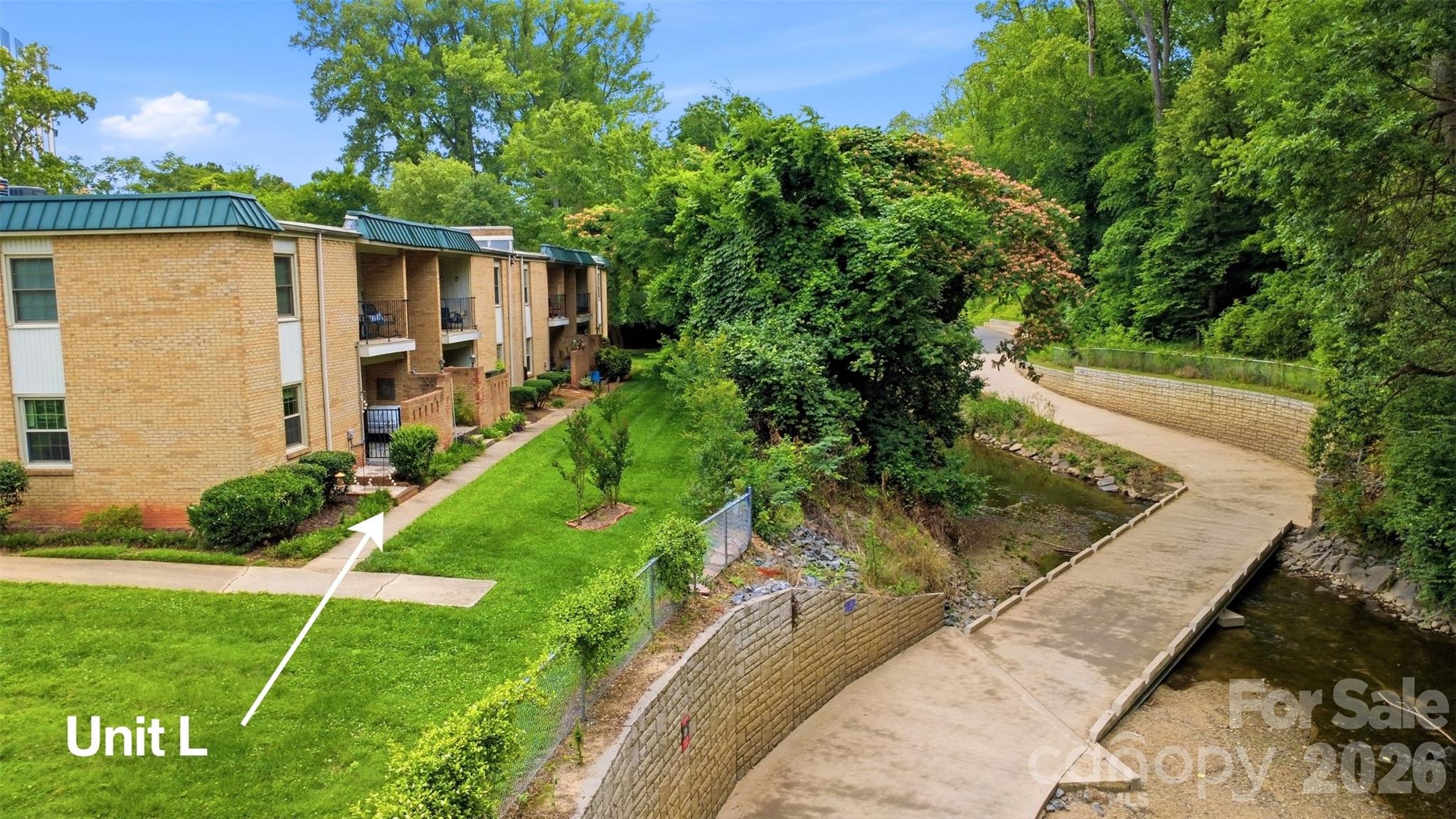 Live on the Little Sugar Creek Greenway and enjoy the perfect blend of nature and convenience. Walk or bike with ease to dining on Montford or shopping at Park Road Shopping Center—this sought-after lifestyle is truly hard to find.
Step outside and find the greenway quite literally in your backyard. Open your sliding glass door to a serene pebble-tiled patio, the perfect place to unwind while taking in beautiful, peaceful views—also enjoyed from the primary bedroom.
This home was fully updated in 2022 and is completely move-in ready. The stunning kitchen features a cooktop, wall oven, and smart refrigerator, combining style with modern functionality. The seller is also including a stackable washer and dryer for added convenience.
Don’t miss this rare opportunity to own a home where comfort, style, and location come together effortlessly.