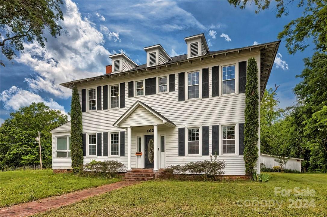 Price improvement!  This is an incredible opportunity to own a large historic home in the heart of Lancaster.  Perfect for an investor or someone who loves to restore old homes, this 5 bedroom, 4 bathroom home has so much potential.  You will love the large sunroom, woodburning fireplace, huge yard and basement.  High ceilings, french doors, wood floors throughout most of the home and a detached 1 car garage with storage add to the appeal of the home.  If you have been looking for a historical home with character, this could be the one.  Close to shopping, restaurants and entertainment and a short drive to Charlotte.  All appliances and contents remain in the home.  Being sold AS IS.  Repairs are needed, as reflected in the price.  Don't miss this rare find!