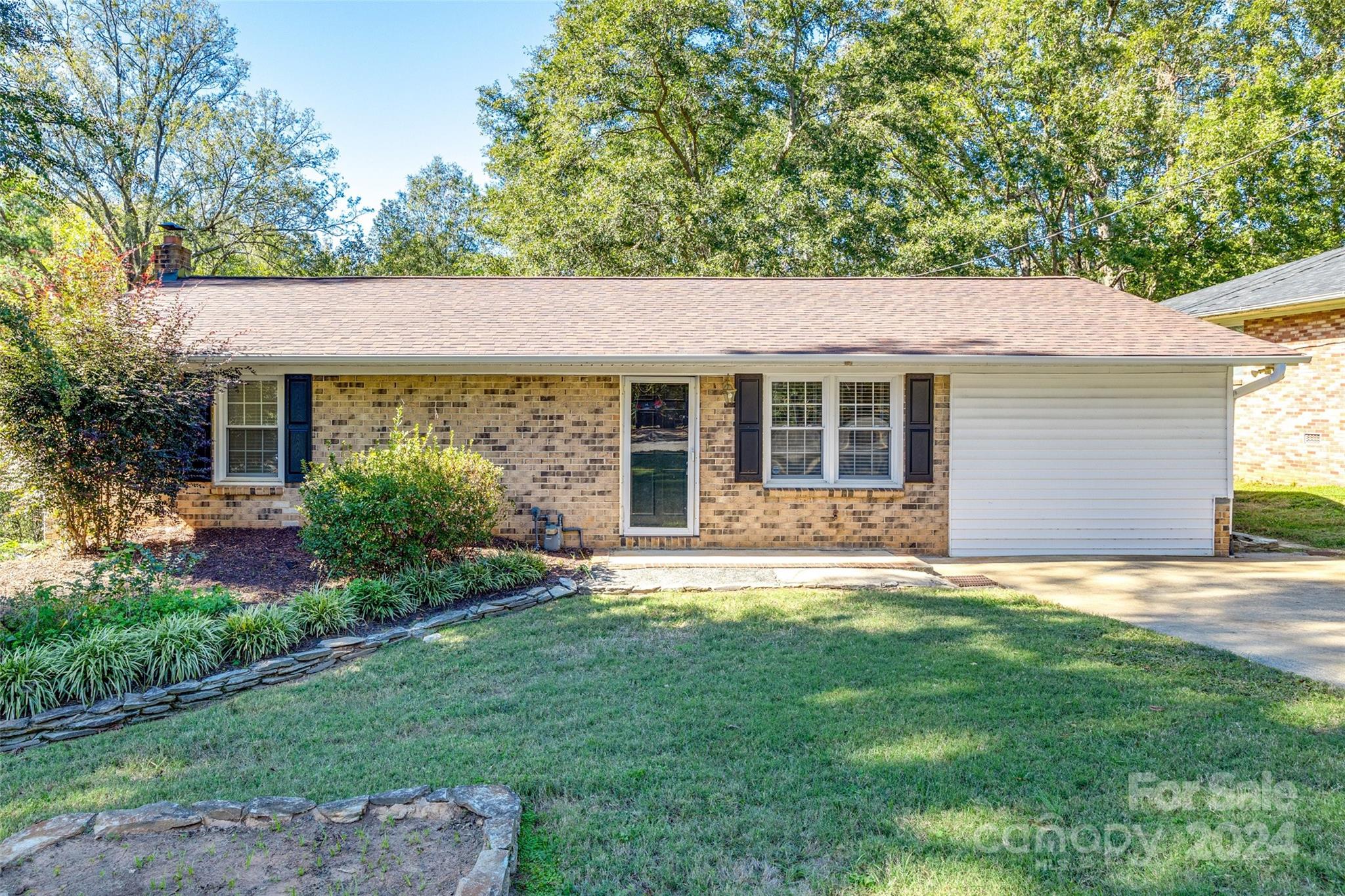 Back on market at NO fault of sellers! Buyer was unable to obtain financing. New roof AND gutters professionally installed 05/24. Situated just minutes away from Downtown Rock Hill and offers convenient access to parks, shopping, Winthrop University, and I-77 for easy commute. Enjoy new LVP flooring throughout all of the bedrooms, kitchen & laundry room. Fresh paint from December 2023 in 3 bedrooms, living room, and kitchen. The primary bathroom was remodeled in January 2023. Enjoy quiet evenings and the serenity of the great outdoors from the comfort of your very large and open backyard! Schedule your appointment today!