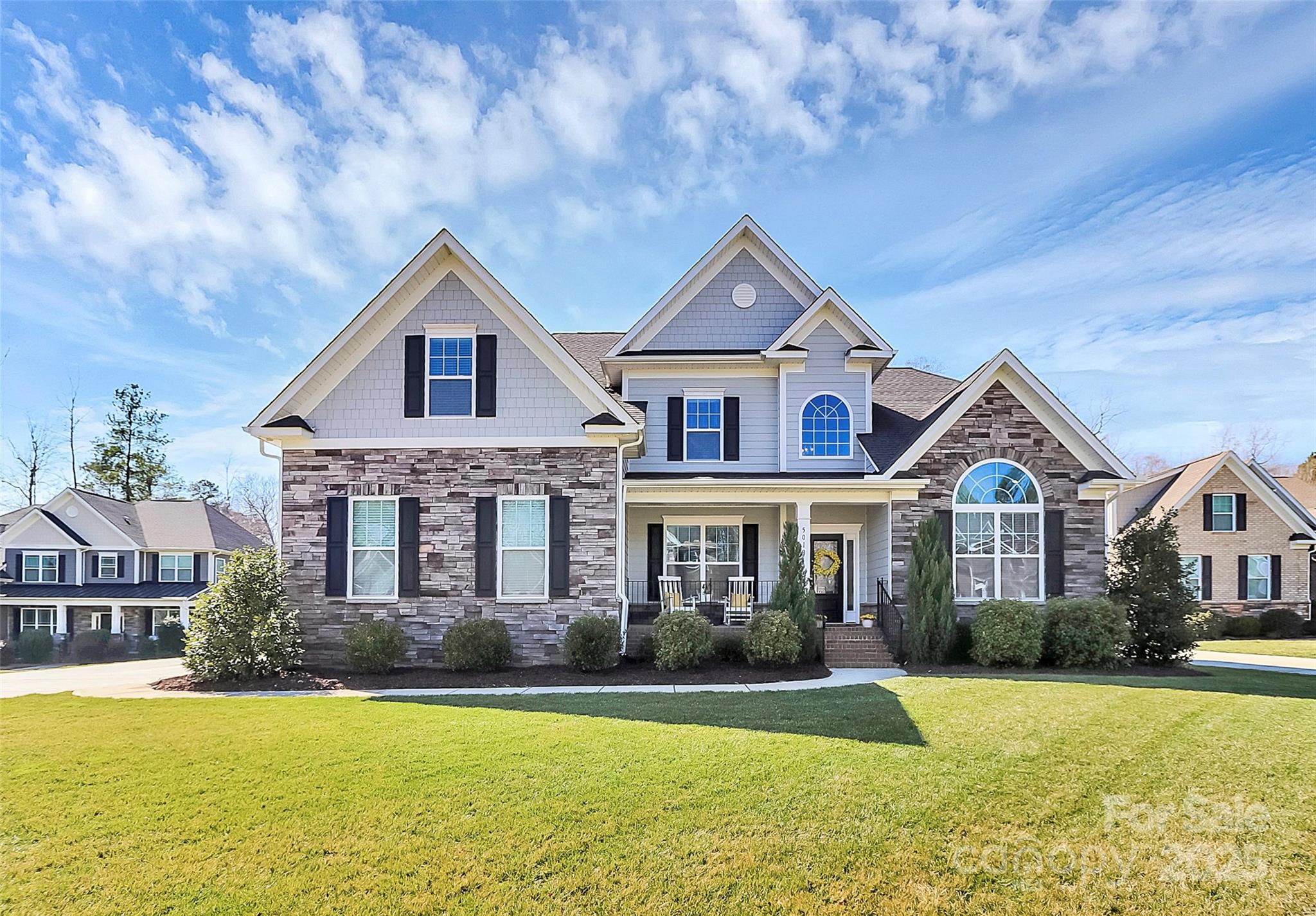 Nestled in the desirable community of The Bluffs near Lake Wylie, this stunning 2-story home offers low-maintenance stone & siding on a spacious 1/2-acre lot. The main-floor primary suite features a spa-like en suite w/ a soaking tub, tile shower, & an amazing walk-in closet. The gourmet kitchen boasts gas cooking, a butler’s pantry, & top-tier finishes, w/ multiple choices for dining from the breakfast area to a formal dining room. Enjoy engineered hardwoods throughout the main level, trey ceilings, crown molding, under-cabinet lighting, & gas logs in the family room. Upstairs, find 4 generous bedrooms, a dedicated flex room, & 2 full baths. On demand gas water heater. Fully fenced backyard w/ an irrigation system. Located in the award-winning Clover School District w/ low York County taxes, this home is minutes from a boat launch, walking trails, the  aquatic center, shopping, & dining. Experience the perfect blend of elegance, comfort, & convenience in this exceptional home!