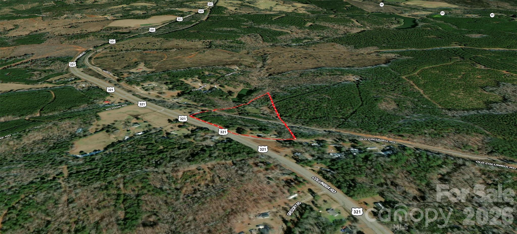 Opportunity awaits on this nearly 14-acre tract located just 3 miles from the City of Chester at the corner of Highway 321 (Columbia Highway) and Old Columbia Highway. Being separated from a larger parcel, this property offers over 1,050 feet of road frontage, creating exceptional access and flexibility for future use.

One of the property's standout features is a picturesque pond that provides a beautiful backdrop for fishing, wildlife viewing, and enjoying the outdoors. While the pond area is separated from the primary buildable portion of the property by railroad tracks and is not considered a practical building site, it adds significant recreational and aesthetic value that is increasingly difficult to find.

Two older mobile homes are currently located on the property and are being given no value. Buyers may choose to remove the existing homes and build new residences, or explore other options permitted by Chester County. The property is being divided from a larger tract, and a survey of the main parcel will be required at the buyer's expense. If the mobile homes remain, county regulations require each to be situated on its own separate 2-acre parcel. 

The combination of extensive road frontage, development flexibility, and recreational amenities creates a unique opportunity for a private estate, family compound, investment property, or future residential development. Conveniently located approximately 10 miles from I-77, the property offers easy access to Charlotte and Columbia, both about an hour away. The new Scout Motors manufacturing facility is also within commuting distance, adding to the area's long-term growth potential. Whether you are looking to build, invest, or create a rural retreat with room to grow, this property offers a rare combination of location, flexibility, and natural beauty.