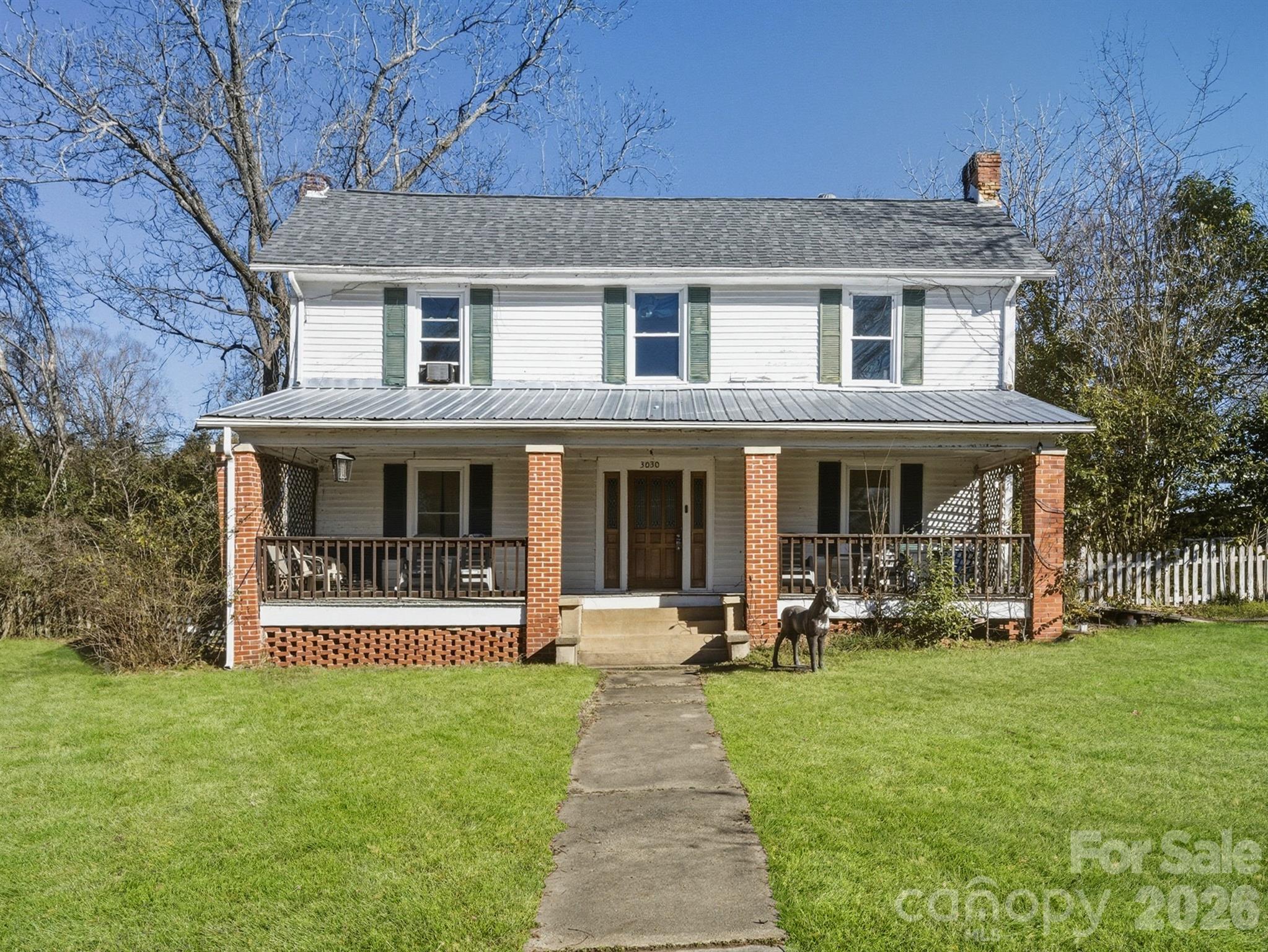 MOTIVATED SELLER! OFFERING 5K IN CLOSING COSTS with full price offer. This charming 1900 farmhouse is full of warm character and country appeal, welcoming you home with a wide front porch and beautiful exposed beams that speak to its history. Thoughtful updates include a newer roof and windows replaced around 2022, blending modern comfort with classic style. The main floor features a cozy primary bedroom with a claw-foot tub and separate shower, while gas heat and electric air conditioning serve the downstairs and the upstairs offers additional bedrooms, a loft area, a walk-in attic, and electric heating and cooling. The kitchen includes an electric stove with gas hookups ready for those who prefer to cook with gas. Outdoors, mature pecan, fig, and black walnut trees add to the farmhouse feel, and a workshop, shed, and lean-to provide plenty of space for tinkering, storage, or creative projects. With room to breathe and endless possibilities, this inviting farmhouse is ready for your personal touch.