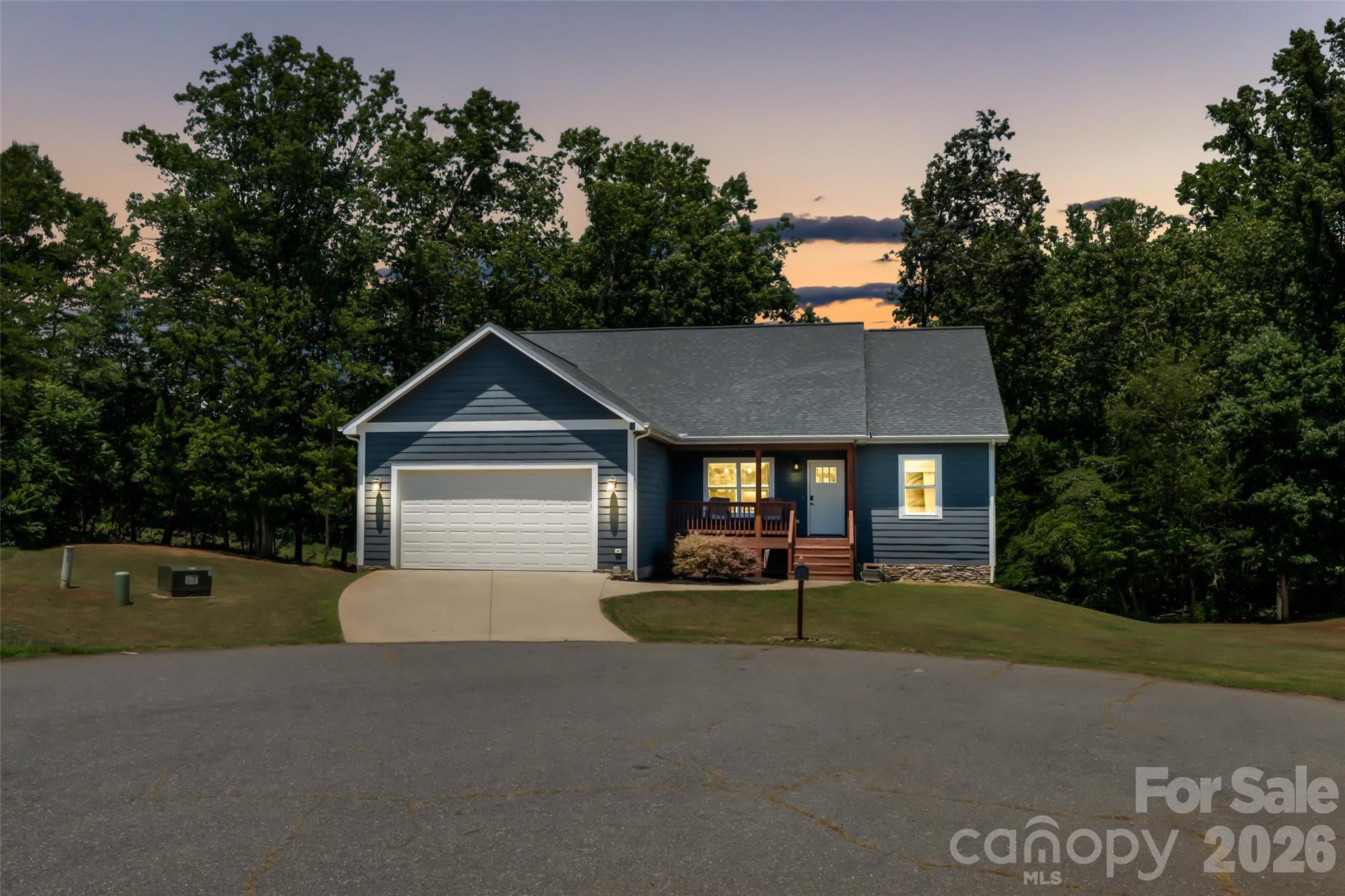 4398 Belmont Dr, Morganton, NC 28655 | Storybook Living in the Salem Area. Every home has a story, but 4398 Belmont Dr is a novel waiting for its next chapter. Picture this: A scenic drive through the rolling foothills of Western North Carolina brings you home to a quiet cul-de-sac just minutes from downtown Morganton. Opening the front door of this stunning 3-bedroom, 3-bathroom single-family residence, the space opens up immediately under the dramatic vaulted ceilings of the main living area.  The centerpiece of the room is a cozy gas log fireplace, seamlessly connecting the living room to a spacious dining area and a beautifully equipped kitchen. Real hardwood flooring stretches across the main areas, complemented by 9-foot ceilings, custom wood blinds, and modern sliding barn doors that add a touch of timeless craftsmanship.  The main floor features a highly functional split-bedroom layout. The primary bedroom serves as a quiet retreat, complete with double closets and an en-suite bath boasting a dual granite vanity and a custom tiled step-in shower. Two additional main-level bedrooms feature generous closet space and share a pristine second full bath. 
The Twist: A Hidden, Multi-Use Lower Level. The story expands downstairs into a massive, finished walk-out basement that adds nearly 1,000 square feet of heated and cooled living space. Complete with durable LVP hardwood flooring and a third full bath featuring its own custom tiled shower, this area offers incredible versatility—ideal for a home theater, recreation room, guest space, or a spacious home office.  Storage and workspace are a major highlight of this property. In addition to the main-level 2-car attached garage and attic pull-down stairs, the lower level contains a massive 562 sq. ft. insulated, unfinished workshop and shed area with double opening doors—perfect for lawn equipment, outdoor gear, or a dedicated hobby space.  Outside, you can relax on the covered front porch or enjoy the covered back deck looking out over a beautifully cleared 0.6-acre lot with a partially fenced backyard. This home is truly remarkable. Make your appointment today!!