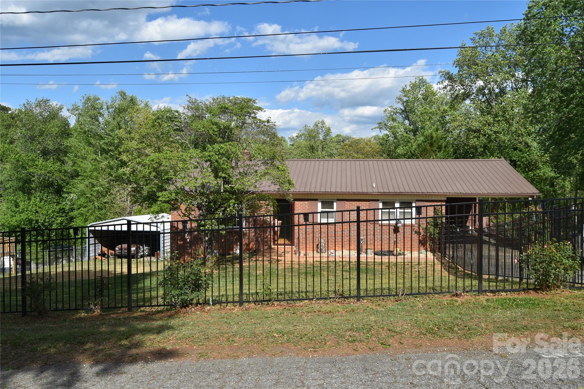 Updated brick ranch with full basement on dead end street. Beautiful hardwood floors in large open flowing living area. The bedrooms are serviced by a hall bath.  Guests are serviced by a half bath. One bedroom has been converted to a laundry but could be converted back to a traditional bedroom. The full basement has some finished areas, a full kitchen and a second laundry room and partitioned rooms in addition to workshop areas. The potential is endless for further expansion.  The yard is completely fenced for pets safety. The back yard is also fenced and has a large salt water pool. The pool area has a gazebo and features a cleaning system for the pool. The side yard features the double detached carport. The HVAC is only 3 years old among other updates. The location is near major road access, schools, grocery stores and shopping.