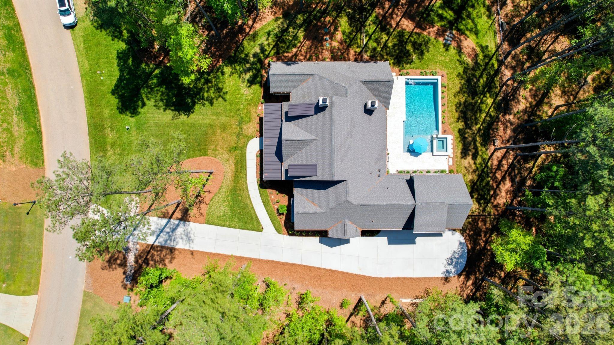 Welcome to 6223 Chimney Bluff Road! One of the best lots at Riverchase Estates. This isn't just a home; it’s a breathtaking 1.63-acre sanctuary where architectural elegance meets the raw, untouched beauty of nature. A rare double lot that backs directly onto 500 acres of protected conservation land, this estate offers the ultimate luxury: complete privacy.
While the interiors are a masterclass in design, the outdoor living space is where your summer dreams truly come to life. Step out onto the massive 34x16 covered screened porch, where you can grill at the island or curl up by the wood-burning fireplace while looking out over your resort-style oasis. The centerpiece is a magnificent 18x38 heated pool and spa, finished with exquisite marble pavers.
Whether you are cooling off on a hot Carolina afternoon or hosting a sunset poolside gathering, this space is ready for you to create a lifetime of memories.
In addition, the encapsulated crawl space with a dehumidifier ensuring structural perfection and do not forget the direct to the river walk access that connects you to a truly outdoors experience.
This is more than a residence—it is "The One" you’ve been waiting for.